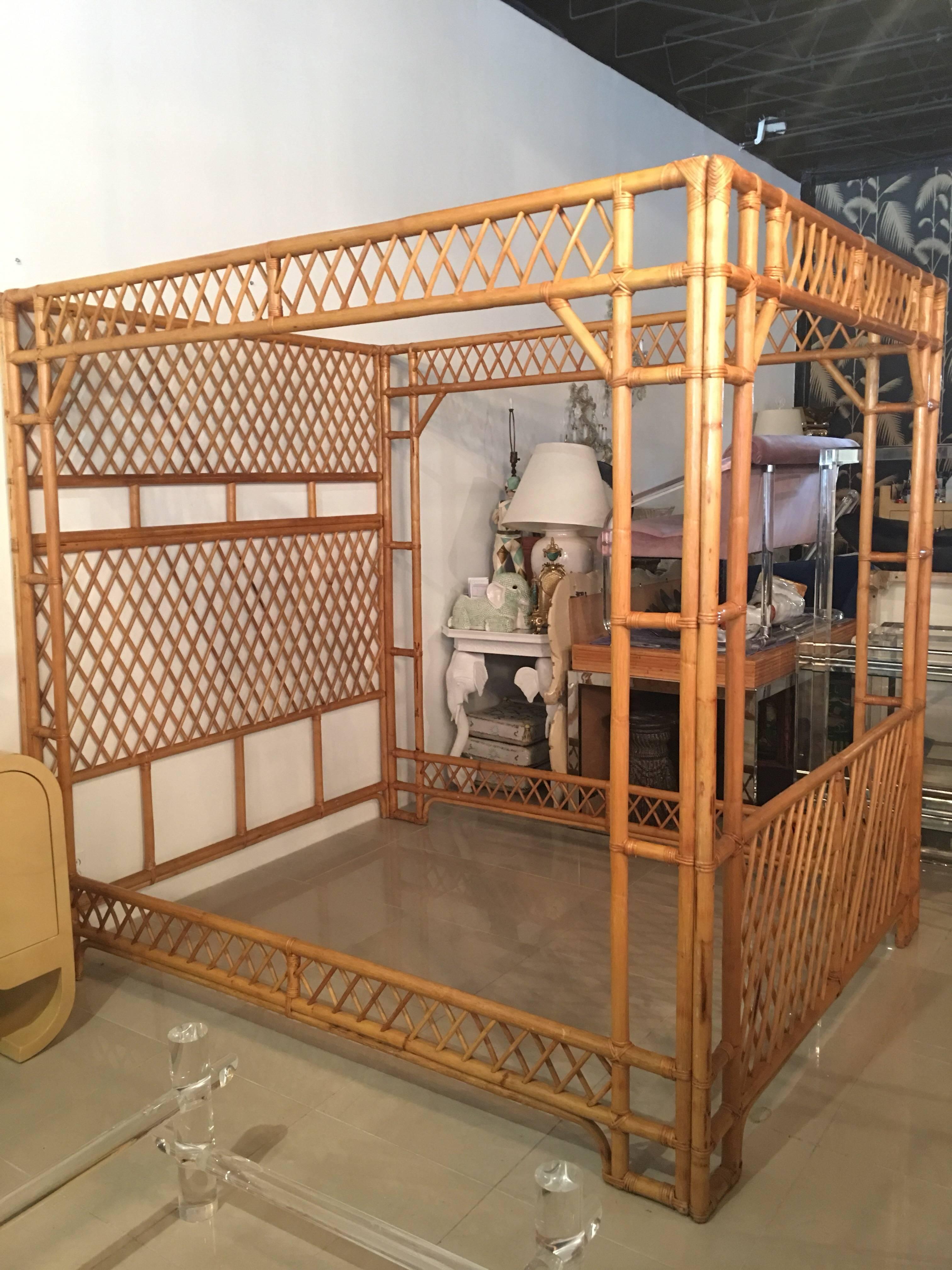 Amazing vintage Chinese Chippendale rattan queen-size canopy bed. Bed comes apart in four sections: Headboard, footboard and both side sections. Great tropical island, Palm Beach look!