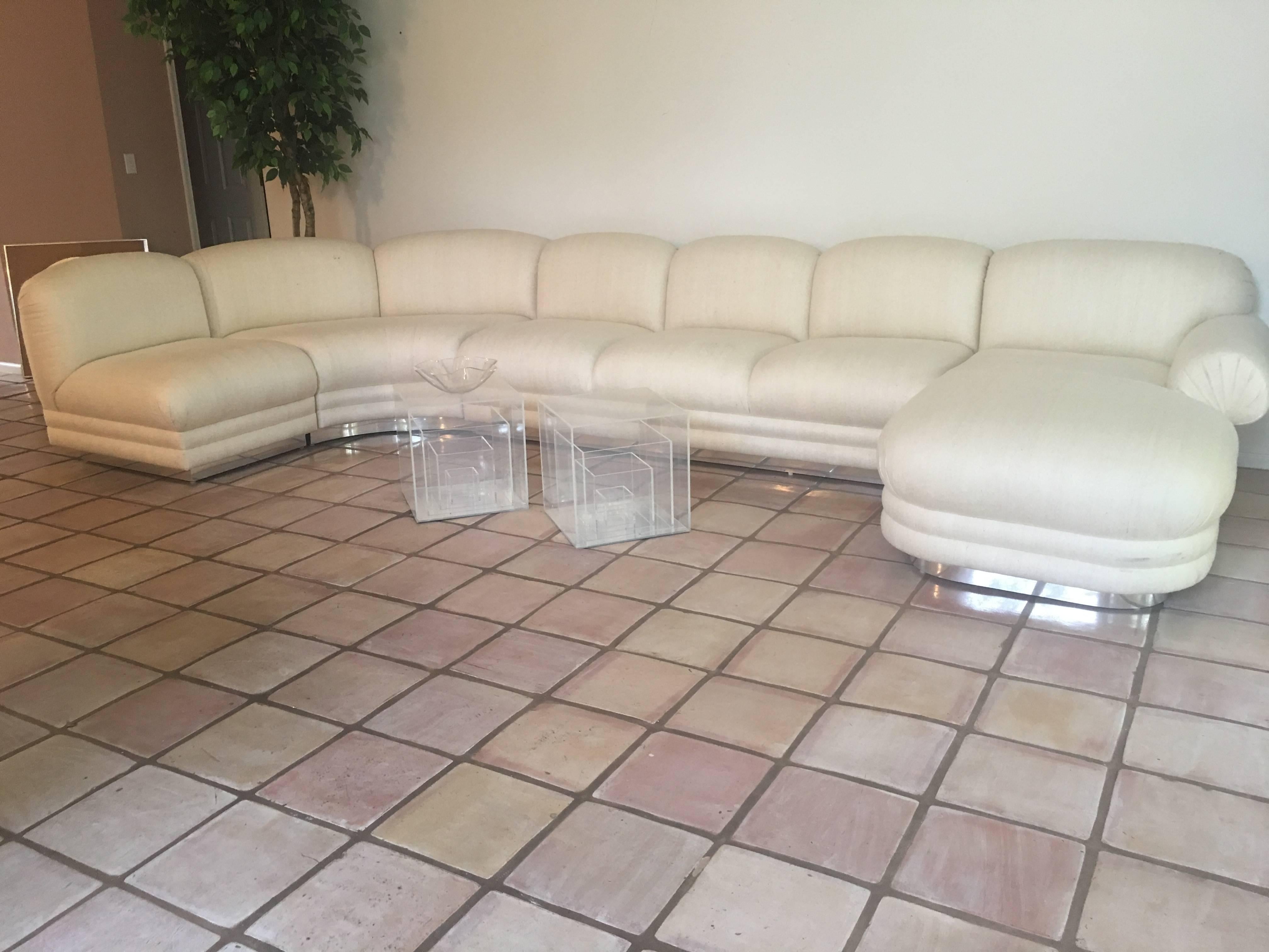 Vintage four four-piece sectional sofa with chaise. Chrome base. This can be rearranged in different styles. Original vintage fabric that has some stains and discoloration, new upholstery recommended. 
Chaise is 70 deep.