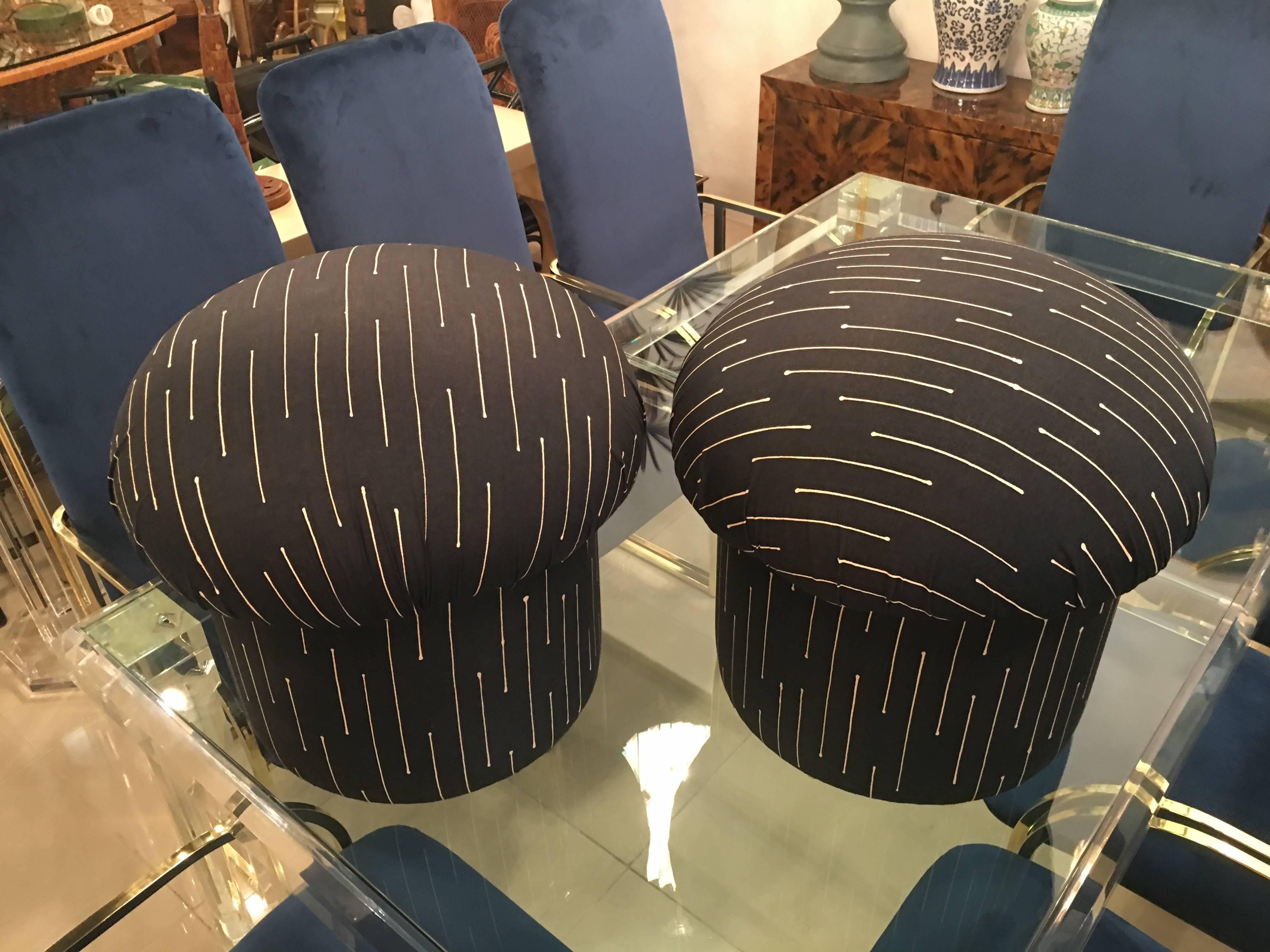Vintage pair of mushroom stools, benches, ottomans with original retro graphic upholstery. The upholstery has been professionally steam cleaned and is free of defects, rips, tears or stains. These are great flanking a coffee table, under a console