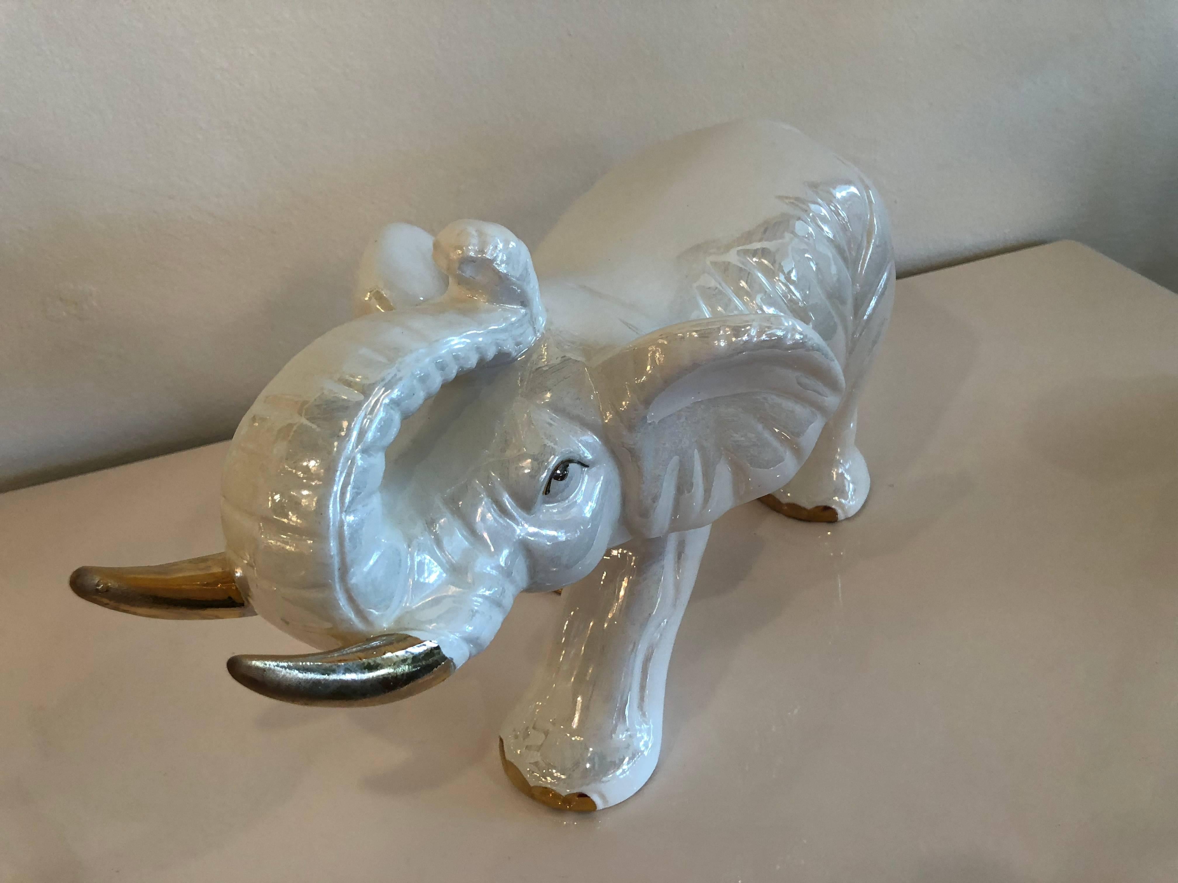 Vintage ceramic white elephant with gold tusks. No chips or breaks.