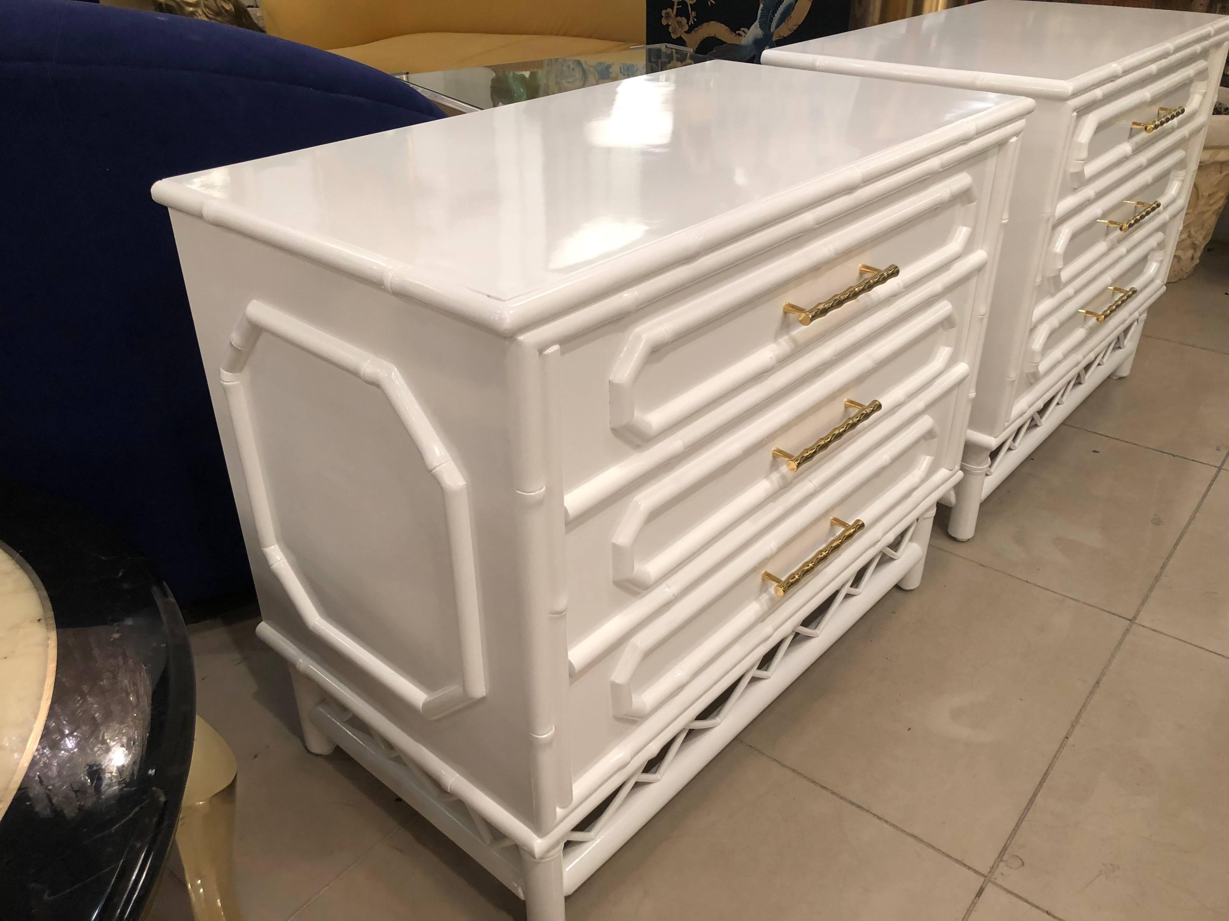 Fabulous Ficks Reed pair of vintage faux bamboo, Chinese Chippendale three-drawer chests nightstands. Rattan bottom, faux bamboo brass hardware. Professionally restored. White gloss lacquer including inside the drawers and back. Perfect Palm beach