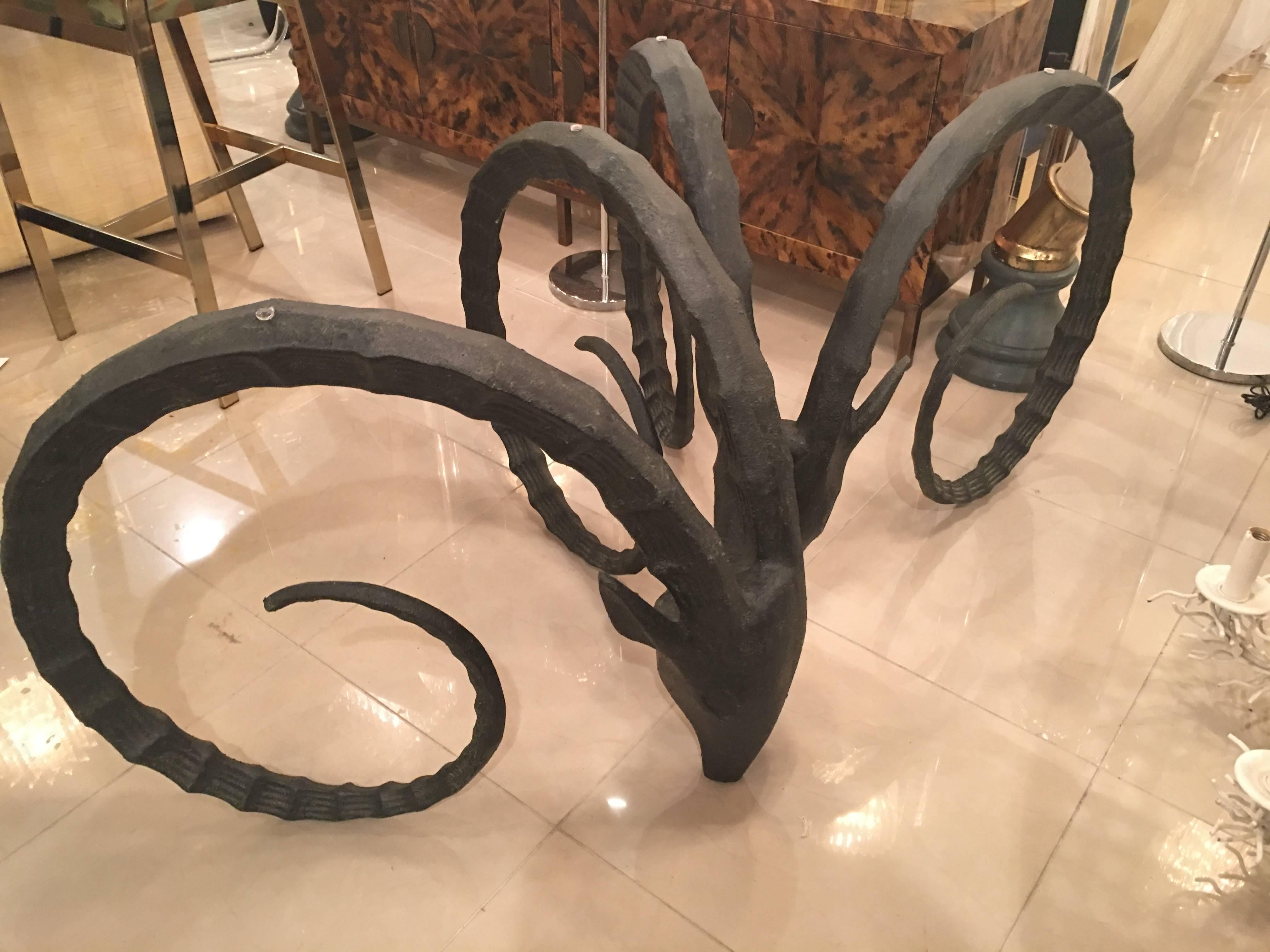 Lovely pair of very heavy vintage ram's head, rams, ibex, gazelle, dining table or office desk base. Glass top not included.