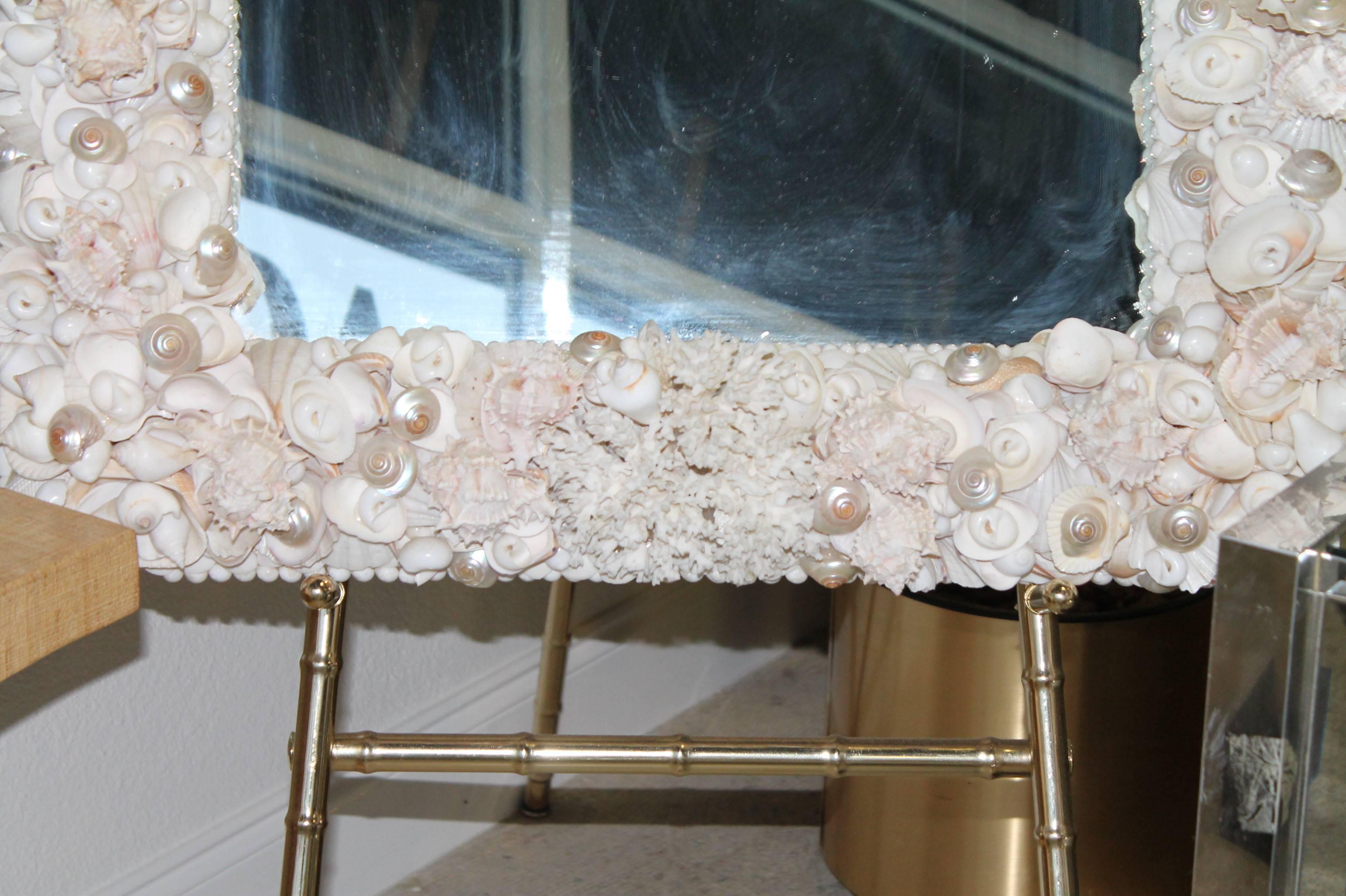 Vintage Encrusted seashell and coral mirror. Every inch of this mirror is covered and layered high with top quality shells and white coral. In the style of Christas South Seashells 
