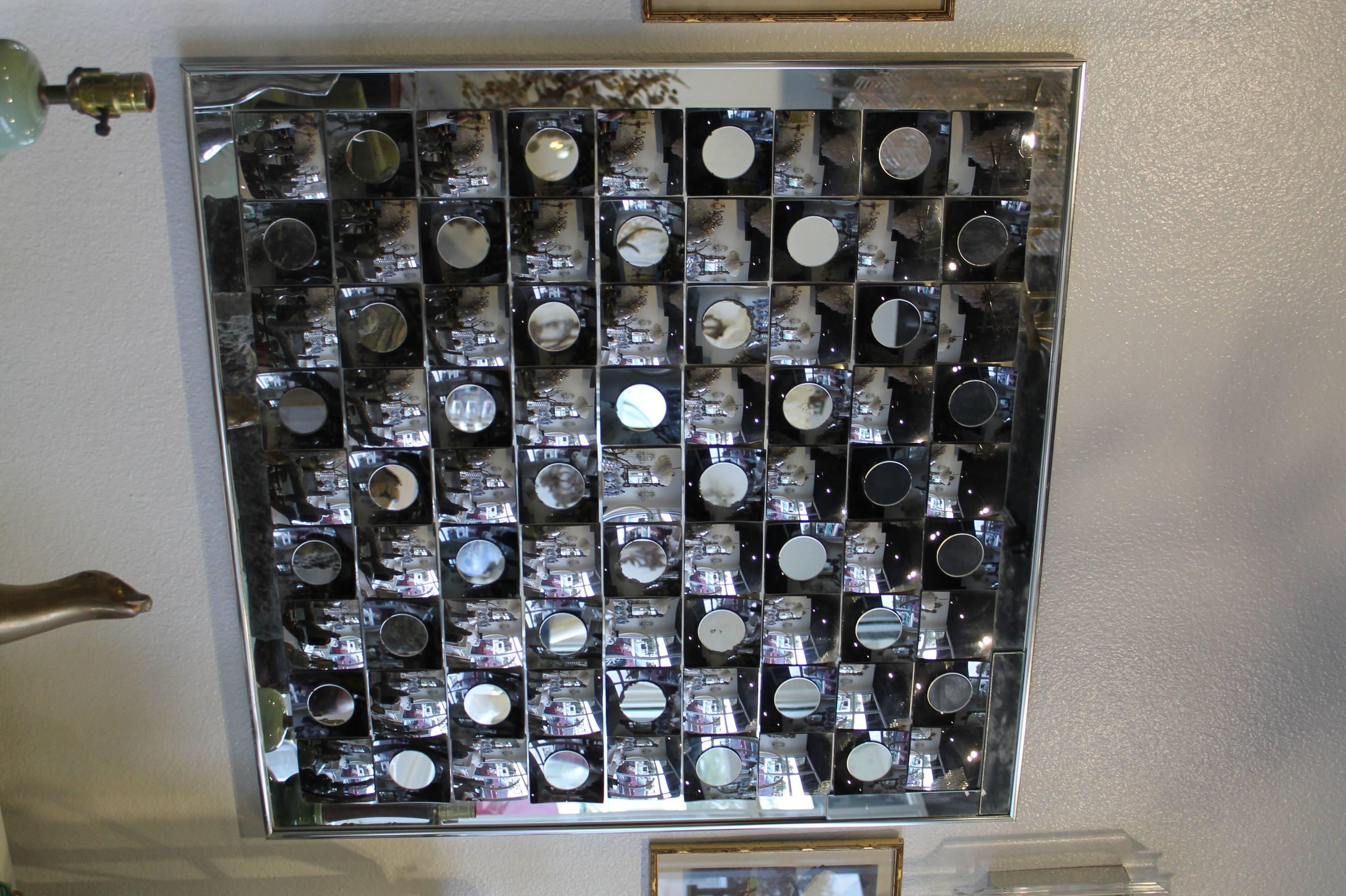 Op Art vintage wall mirror signed by Hal Bienenfeld. Some mercury loss to a few of the small round mirrors (pictured) which is normal for the age and does not detract from the piece. Perfect for the Hollywood Regency or Mid Century Modern décor.
