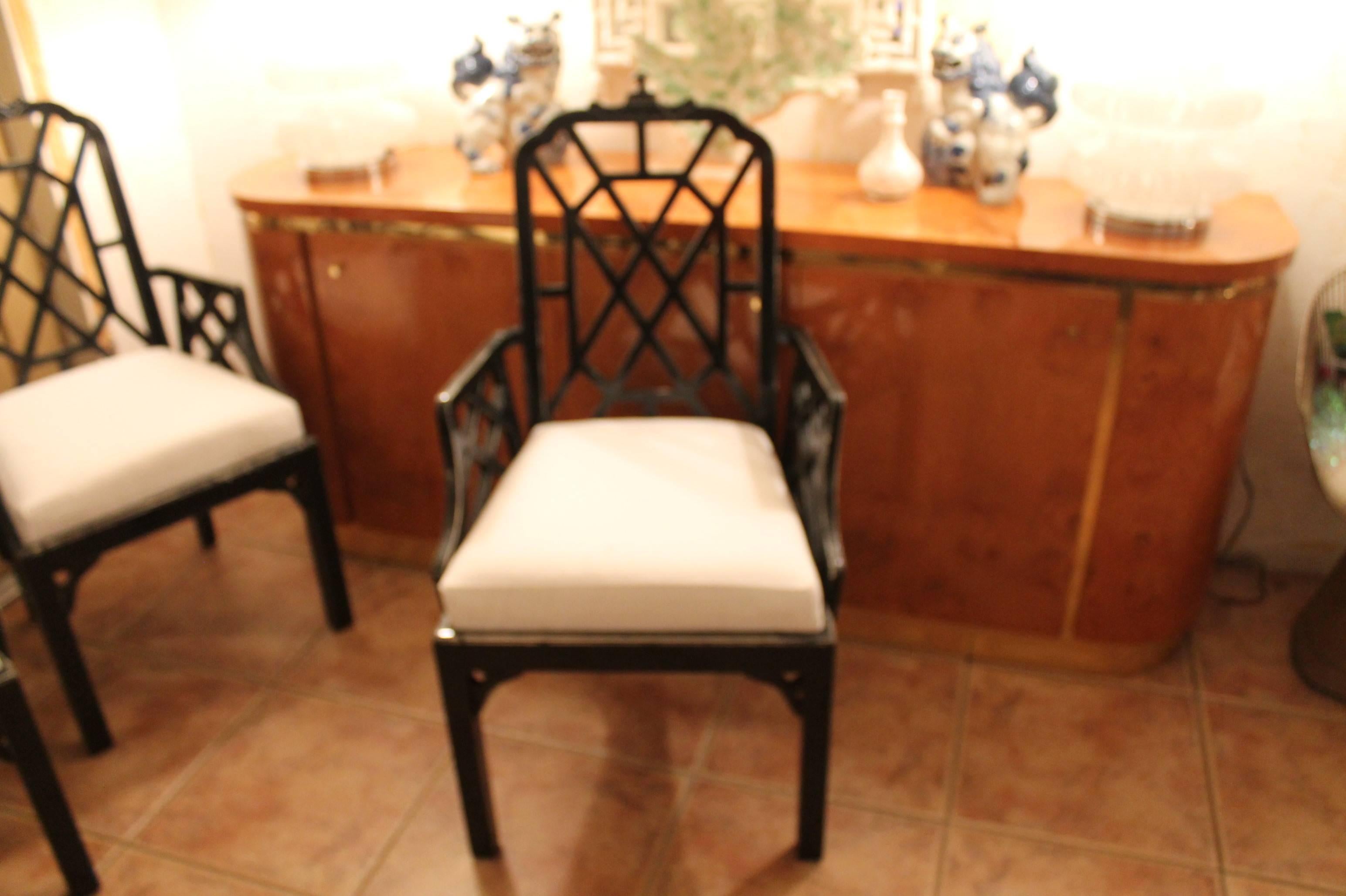 Set of six or 10 Pagoda Chinese Chippendale arm dining chairs. These have there original fabric and will need to be reupholstered. The black lacquer finish is also in need of re-lacquer. These would look amazing in a fresh white lacquer.
