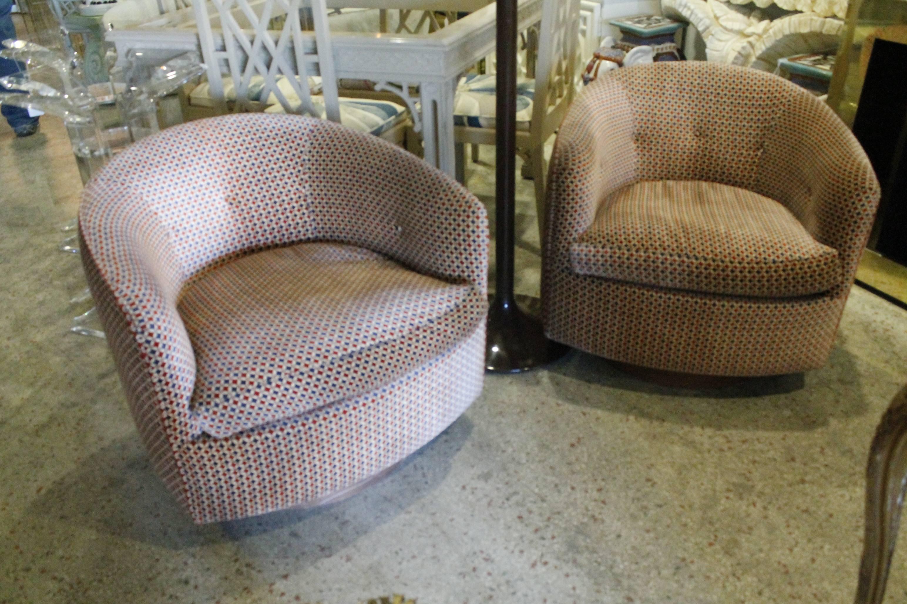 Pair of vintage Milo Baughman for Thayer Coggin (Pictured tag) Swivel Chairs with walnut bases and original retro fabric. The fabric is in really nice condition and has been professionally steam cleaned. 

