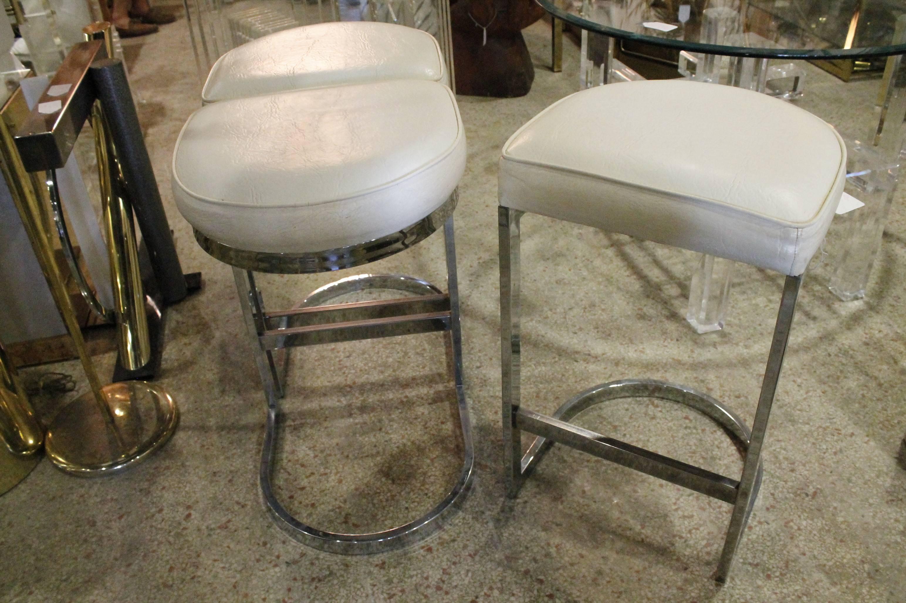 Vintage Set of three chrome cantilever barstools. The leather fabric is original but overall in good condition. The  chrome is in excellent condition. Tagged Dillingham. Dillingham by Milo Baughman.
Hollywood Regency, Mid Century Modern, Vintage,