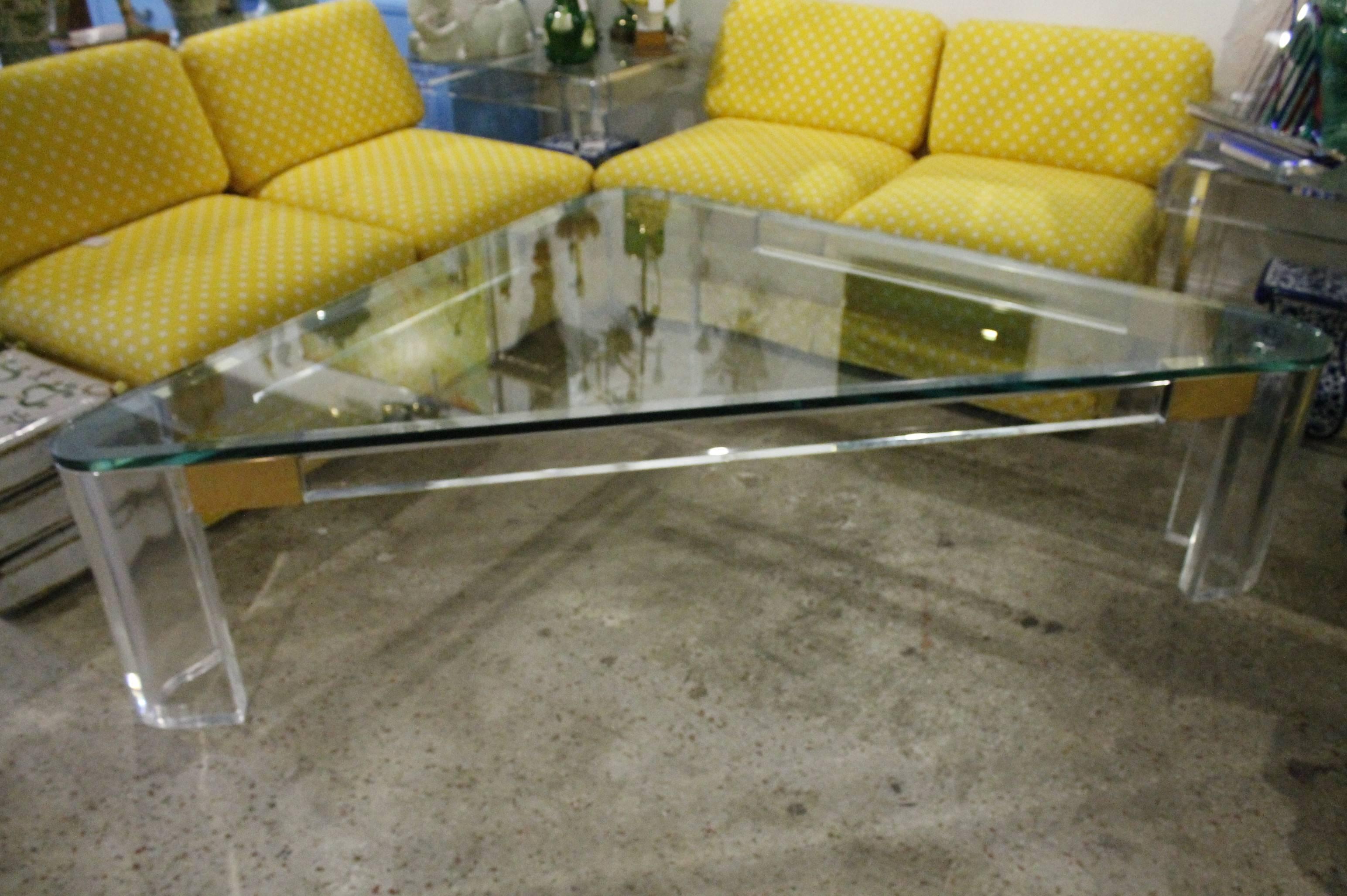 Amazing Vintage Hollywood Regency Monumental Size Lucite and Brass Triangle Charles Hollis Jones Coffee Table. Perfect for sectionals. Extra thick Lucite! 2" thick Lucite! Comes with original 3/4 in thick glass top which does have some surface