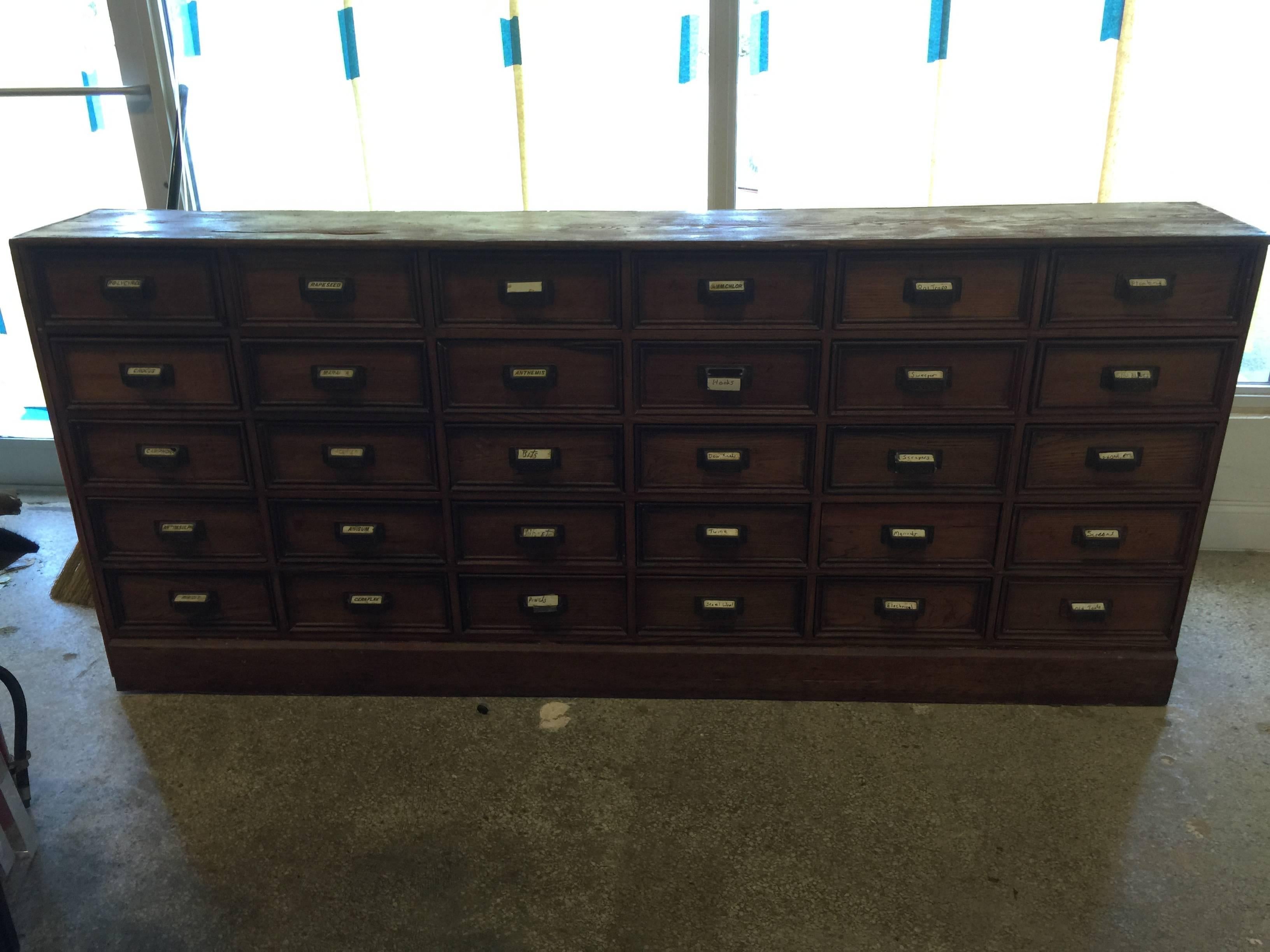 Antique 1900s wood apothecary chest. Most of the herb/medicinal porcelain tags are still in tact. There are a couple missing original porcelain drawer markers. Brass ornate drawer pulls. 30 drawers.

