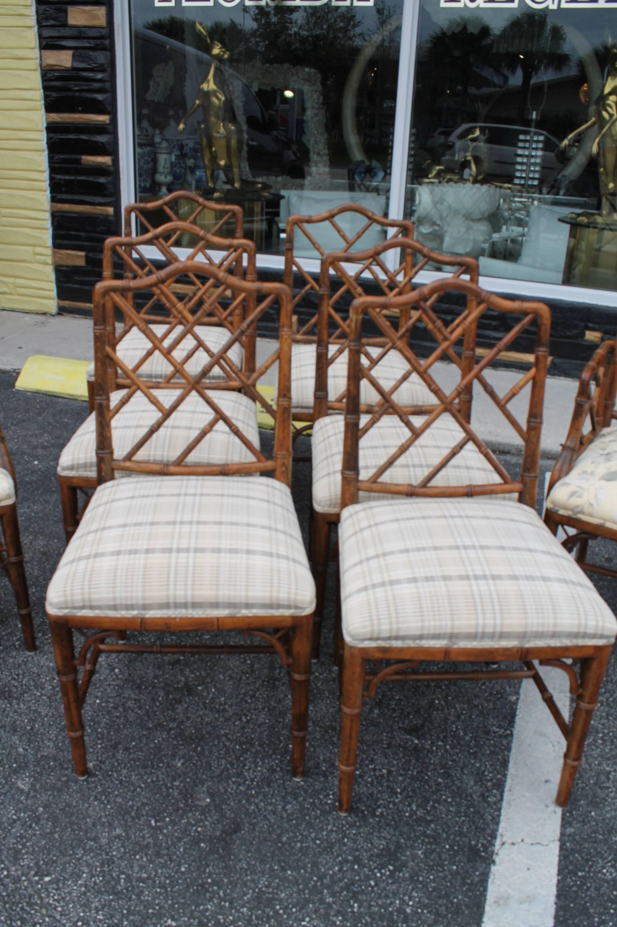 Set of eight incredible Chinese Chippendale faux bamboo fret dining chairs by Century Furniture (each chair is tagged Century) original wood finish in excellent condition with original upholstery that is also in wonderful condition. These were taken