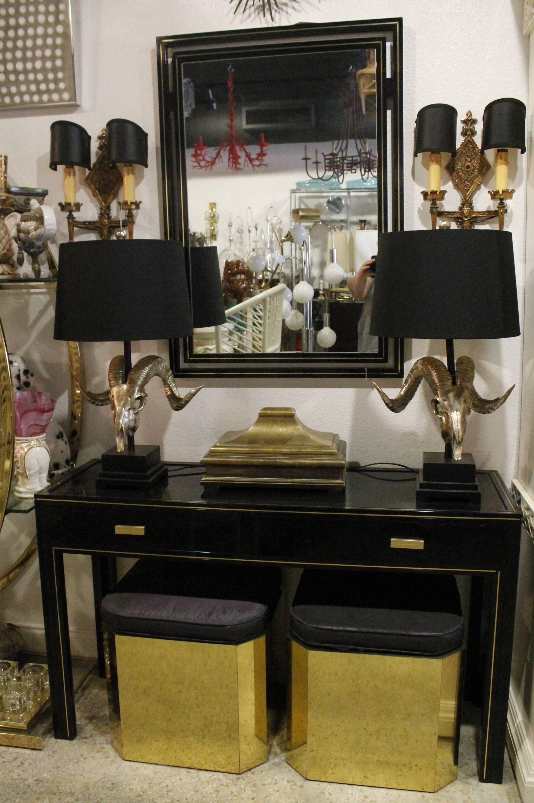 Amazingly beautiful two-piece set by Pierre Vandel Paris (marked). Includes console desk table with drawer and matching wall mirror. Black lacquer, black glass, brass accents. Other pieces pictured other than the console and mirror are sold