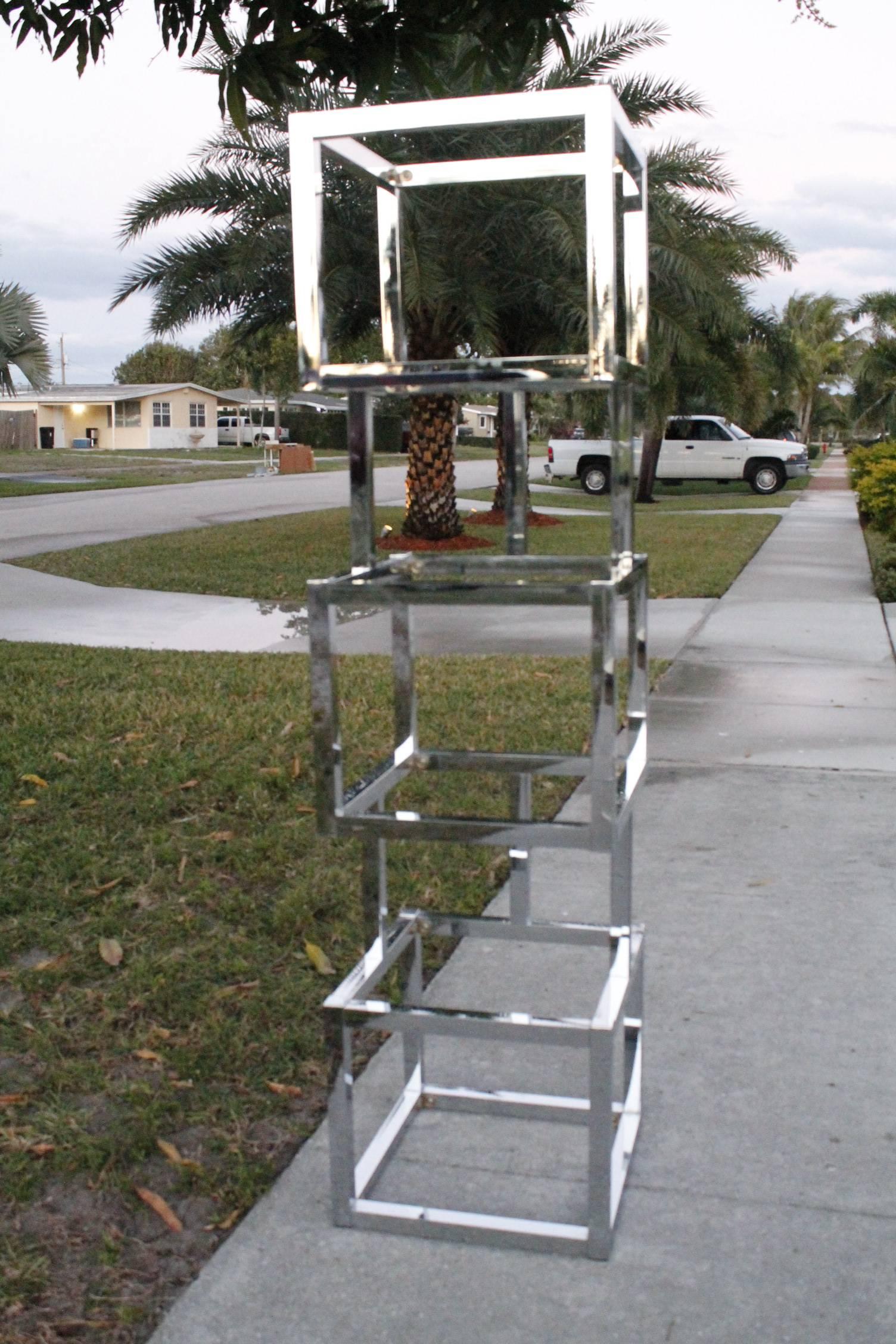 Milo Baughman chrome cube ètagerè with six glass shelves.

  