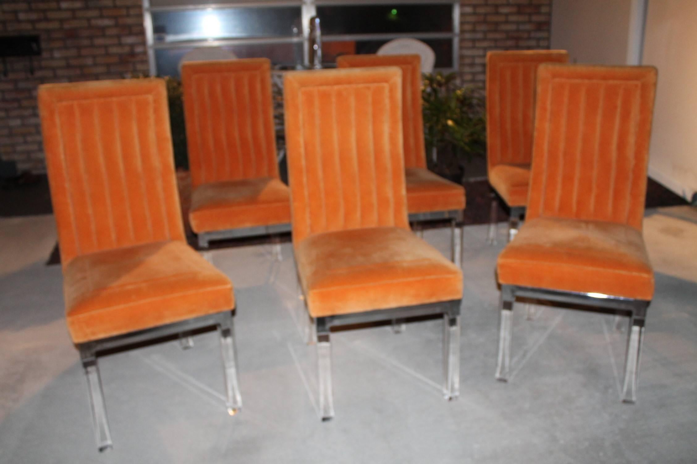 Set of six Vintage Hollywood Palm Beach Regency Charles Hollis Jones by Hill Mfg Lucite and chrome dining chairs. Original channel back orange upholstery will need new upholstery. I have more of these chairs if you need a larger set let me know. I