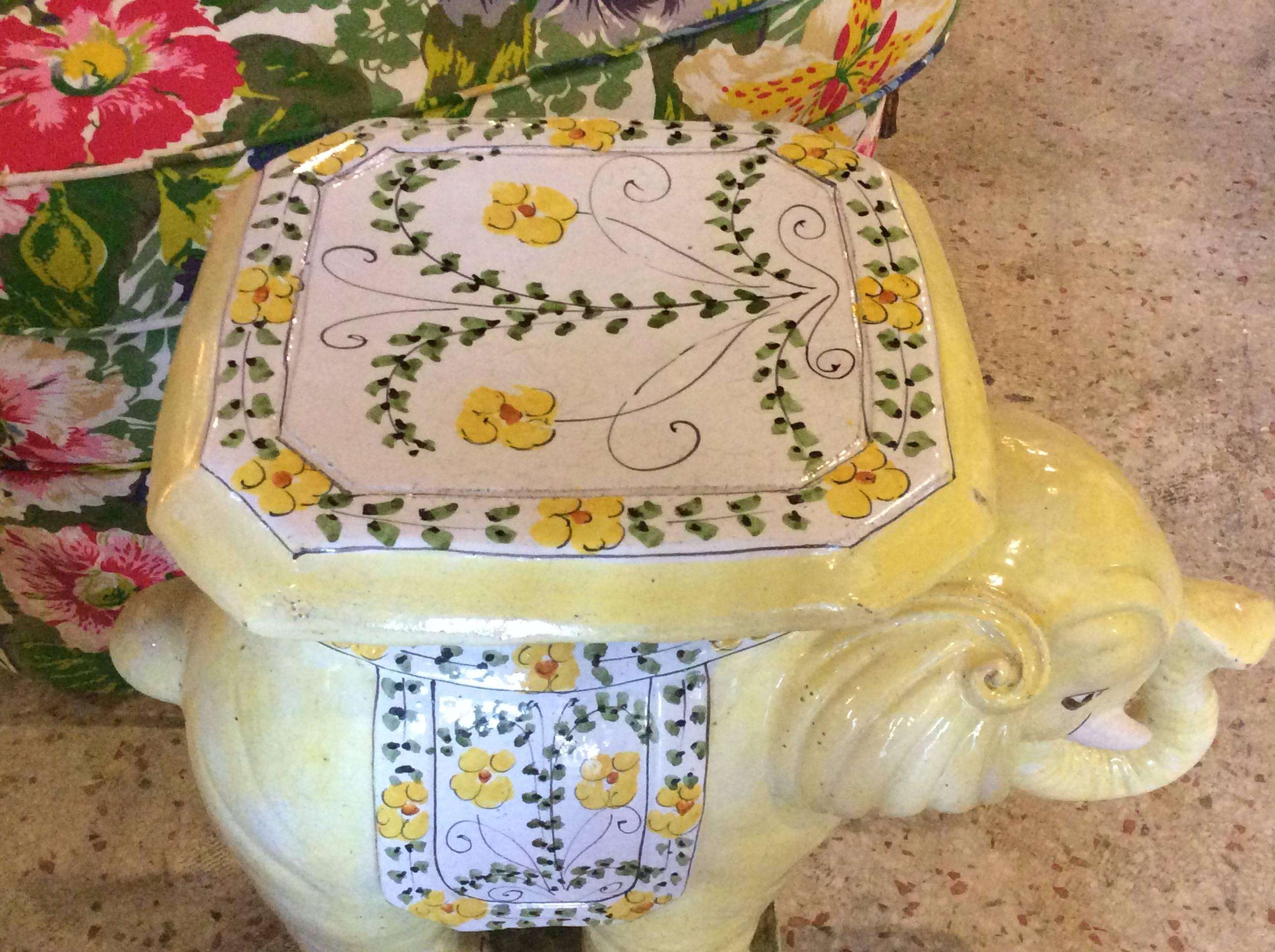 The cutest vintage Hollywood Palm Beach Regency Italian yellow floral terracotta elephant stand. Extremely rare in this yellow color with sweet flowers.
Very heavy! Made in Italy. 
 Can be used as a side end table.
