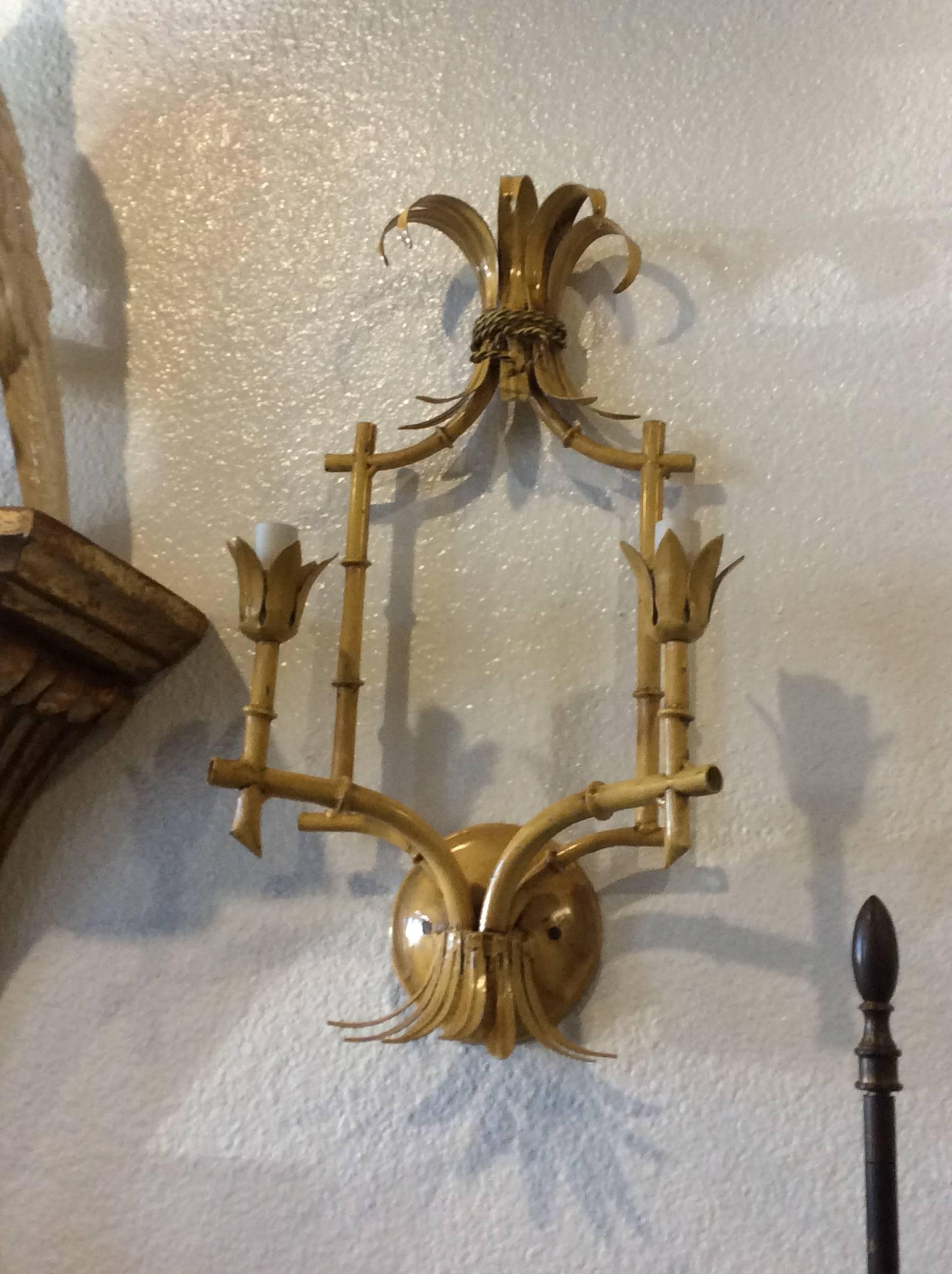 Hard to come by pair of vintage metal tole Italian, Made in Italy, two arm wall lamp sconces. Tested, working order. Original vintage finish in good condition. Can be newly powdercoated in color of choice for additional cost. 
Palm Beach, Hollywood