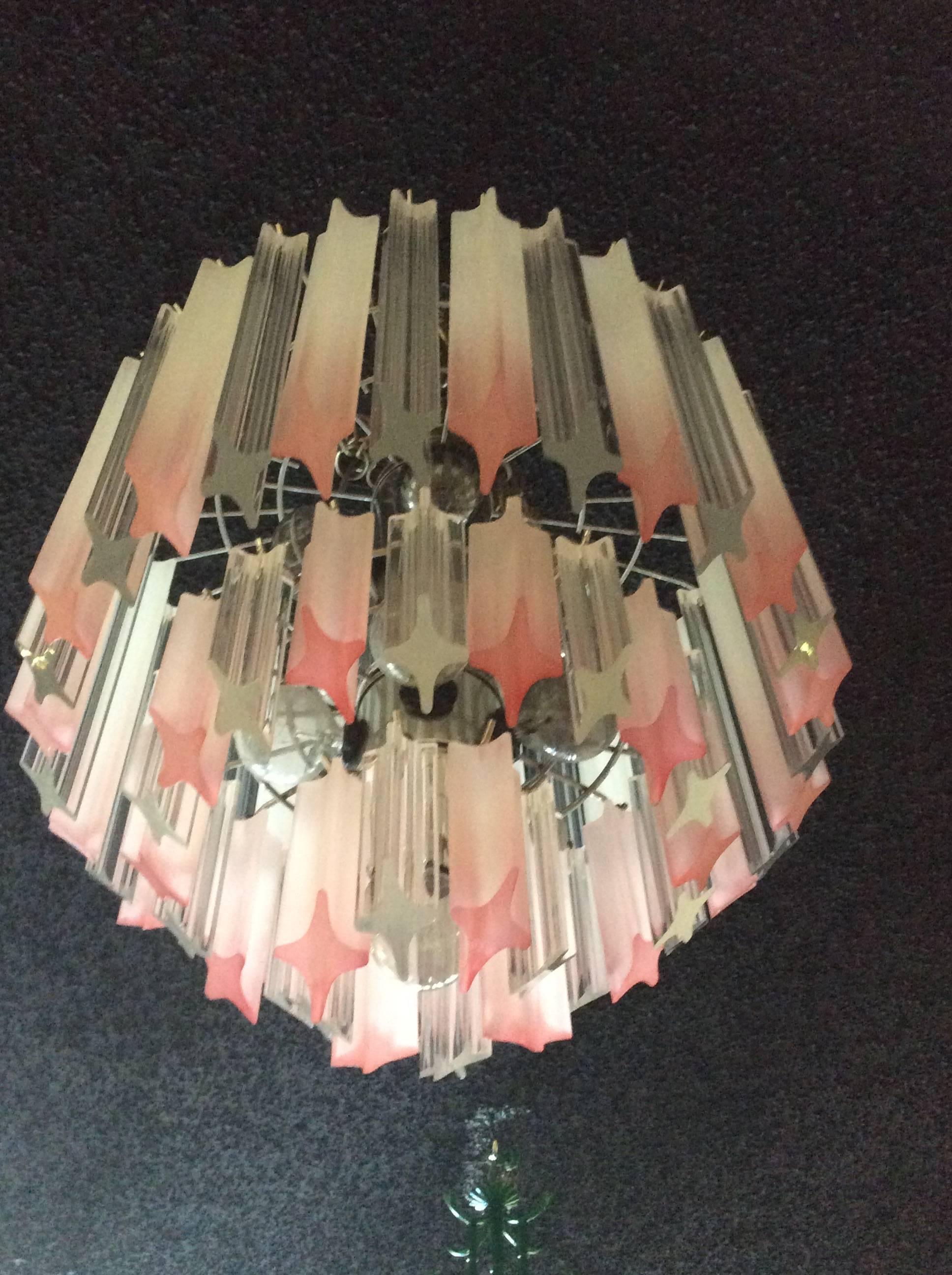 Perfect for a babies nursery, little girls room, big girls room or for that Palm Beach Lily Pulitzer look this pink vintage Hollywood Palm Beach Regency Lucite chandelier will be the icing on the cake! Three-tier with chrome cage. Tested, working