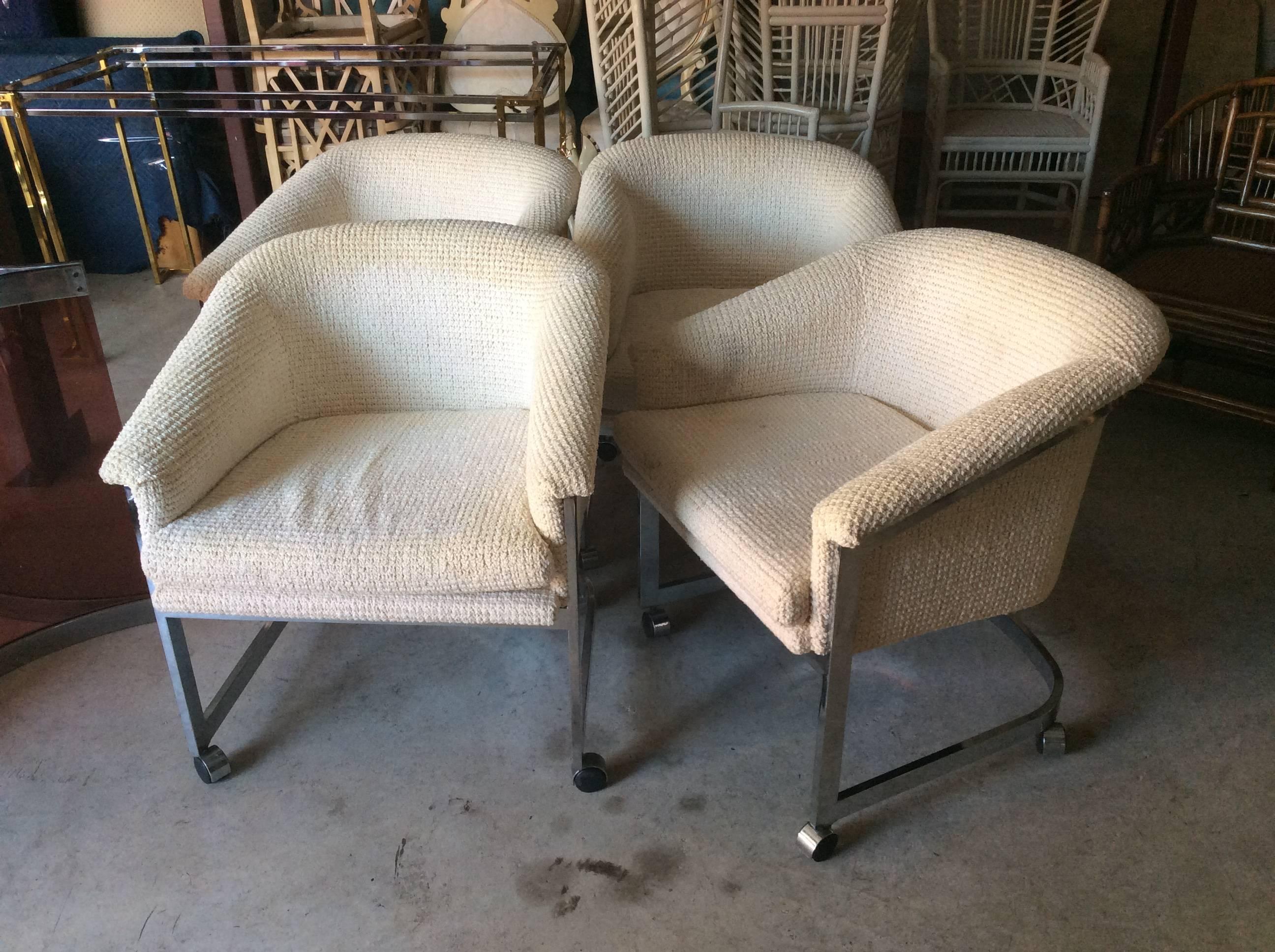 Set of four vintage Hollywood Palm Beach regency,  DIA Design Institute of America (tagged) by Milo Baughman chrome tub, barrel back armchairs with castors, wheels.  Can be used as dining chairs, desk or office chairs.
Original nubby wool fabric has