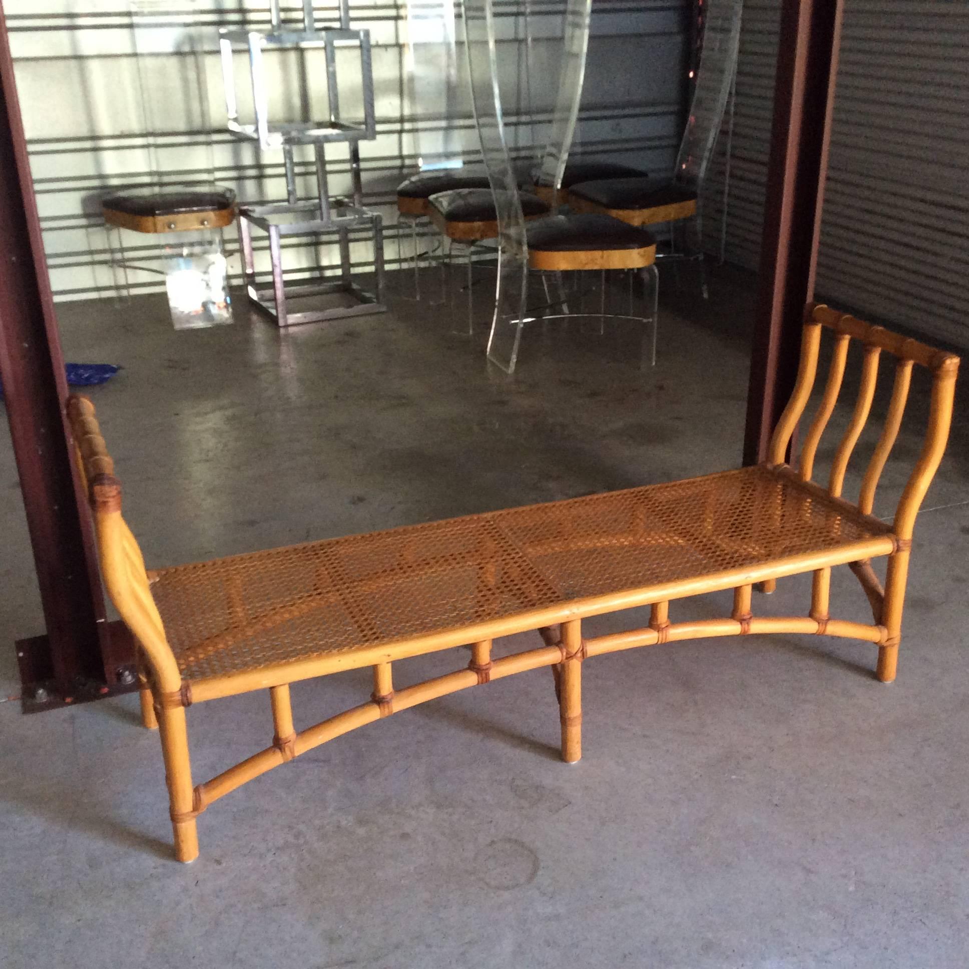 Lovely rattan faux bamboo bench perfect for the end of the bed, entry or foyer, porch or patio, etc. Cane set is in excellent condition as well! Leave as is or add a pretty cushion! 
Hollywood Regency, Palm Beach, chinoiserie, Chinese Chippendale,