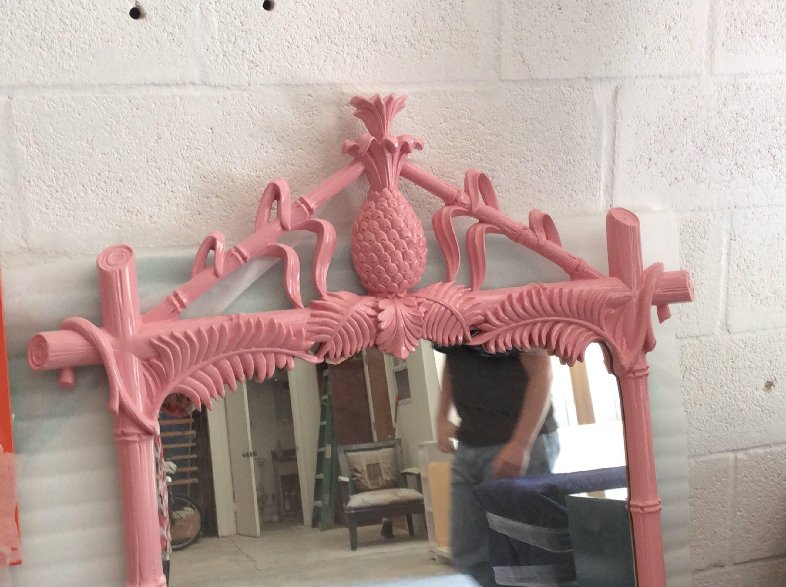 The most amazing vintage Hollywood Regency, chinoiserie wall mirror by Gampel & Stoll newly lacquered in a flamingo pink color. Faux bamboo, Chinese Chippendale, pineapple top and palm frond leaves add to the tropical Palm Beach, Lily Pulitzer