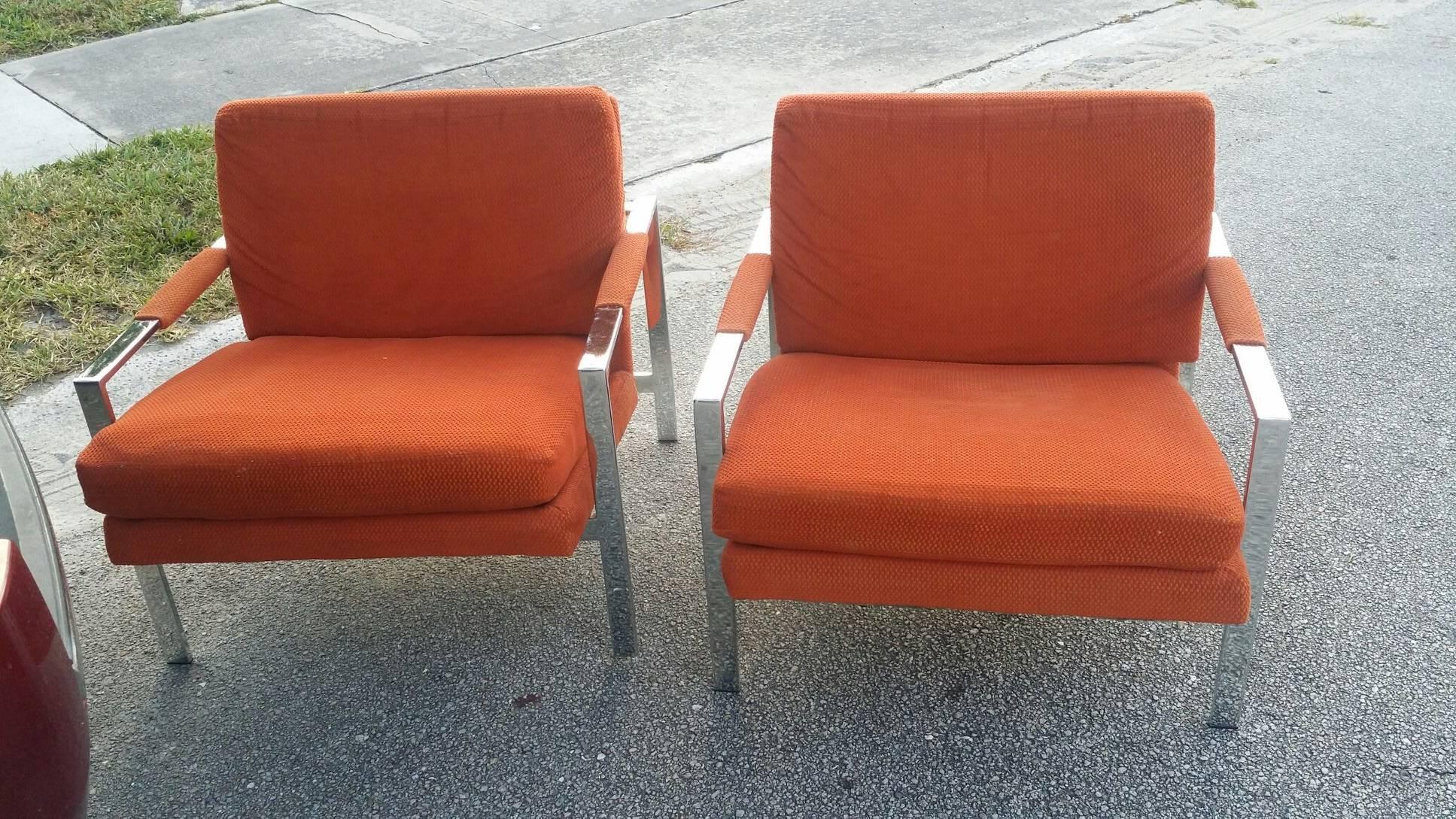 Pair of vintage Hollywood Palm Beach Regency orange fabric, chrome cube flat bar, armchairs by Carson's Furniture (tagged). Original upholstery in good condition with one zipper on the back of cushion needing replacement. In the manner of Milo