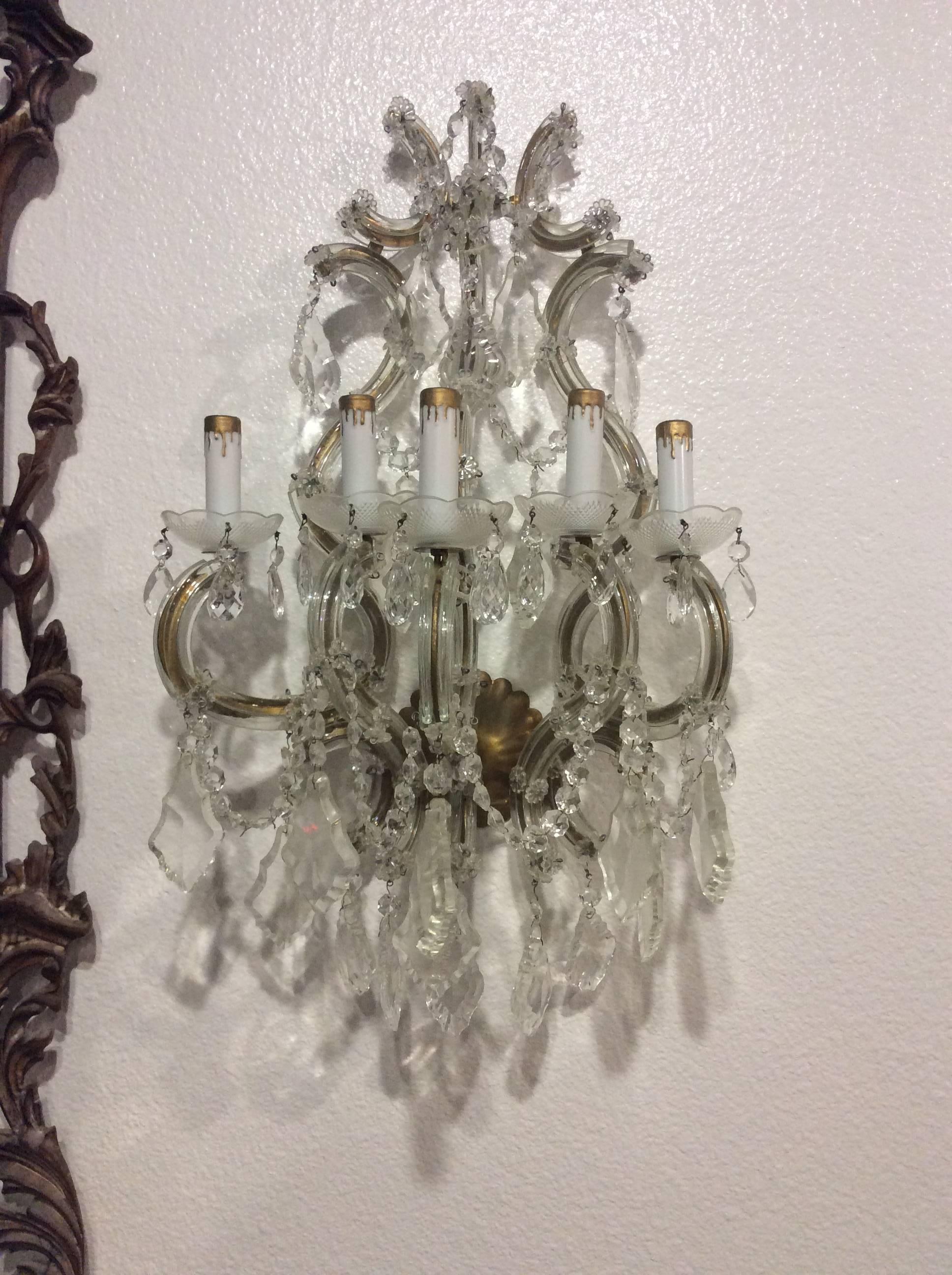 Exquisite Vintage pair of five-light arm sconces. French crystal large pendants, beaded chain, glass bobeche arm cups, crystals, Venetian glass arms and flowers.
Venetian Italian glass flowers, French crystals, gold gilt. Lovely Hollywood Regency,