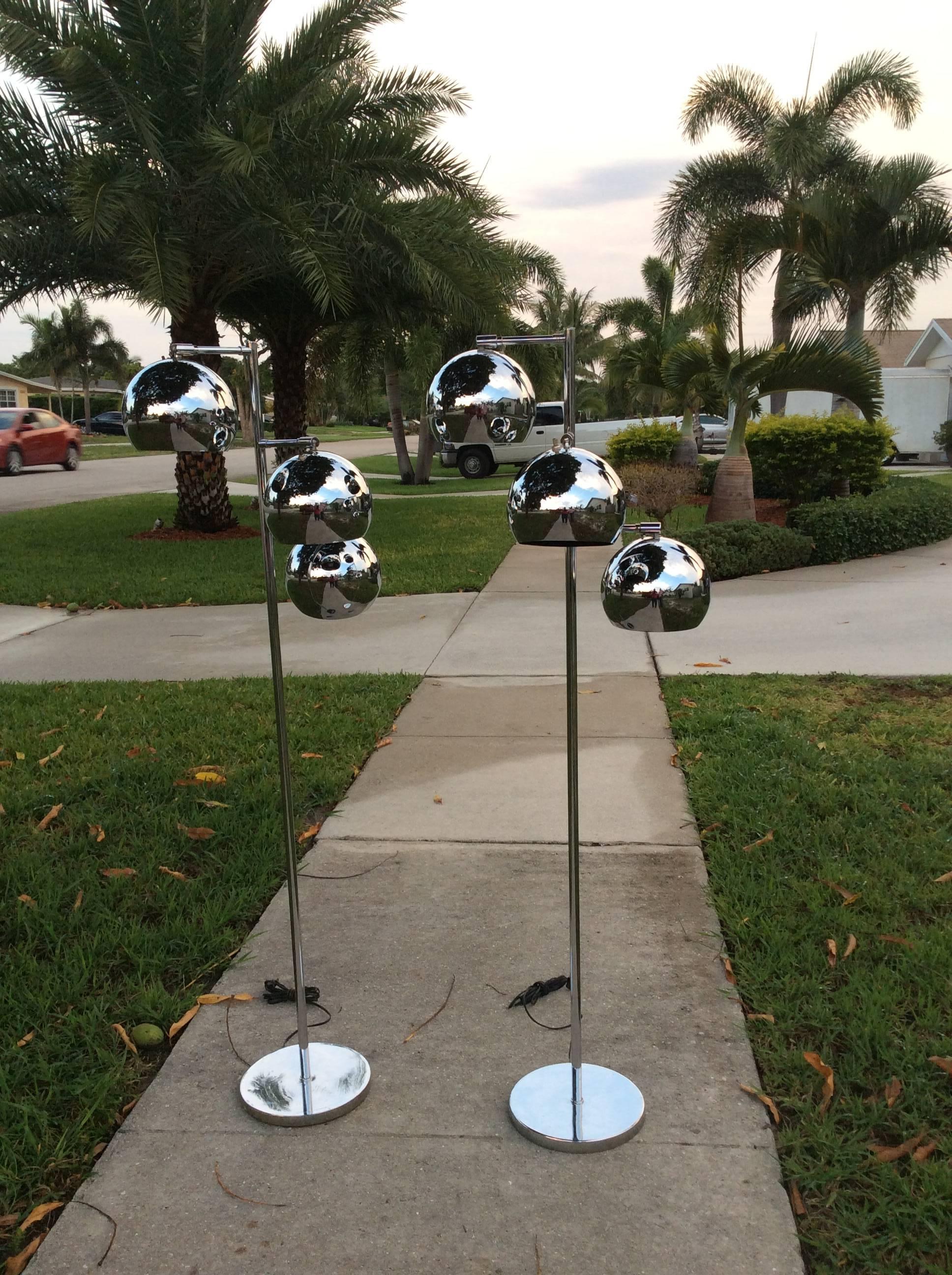 Vintage Mid Century Modern pair of chrome three ball adjustable floor lamps by Koch & Lowy. These will be newly retired prior to shipping. There is a slight indention on the top of the ball where the lamp swivels (pictured)
Great retro look!