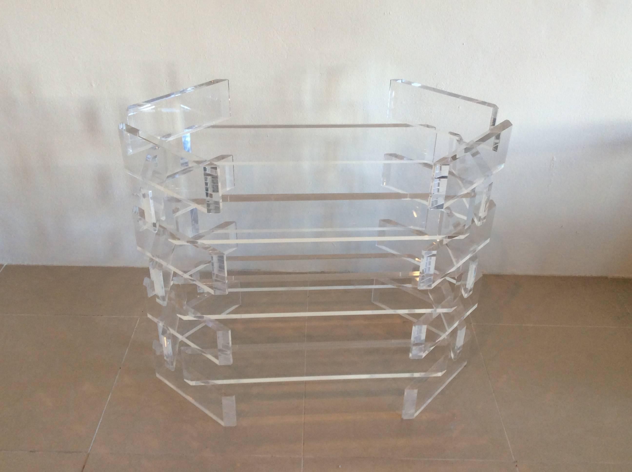 Amazing vintage stacked Hollywood Regency Lucite base which can be used as a dining table or an office desk. Glass top not included. The many cuts and facets on the edges make this sparkle and shine! Lucite is in excellent condition!
In the manner