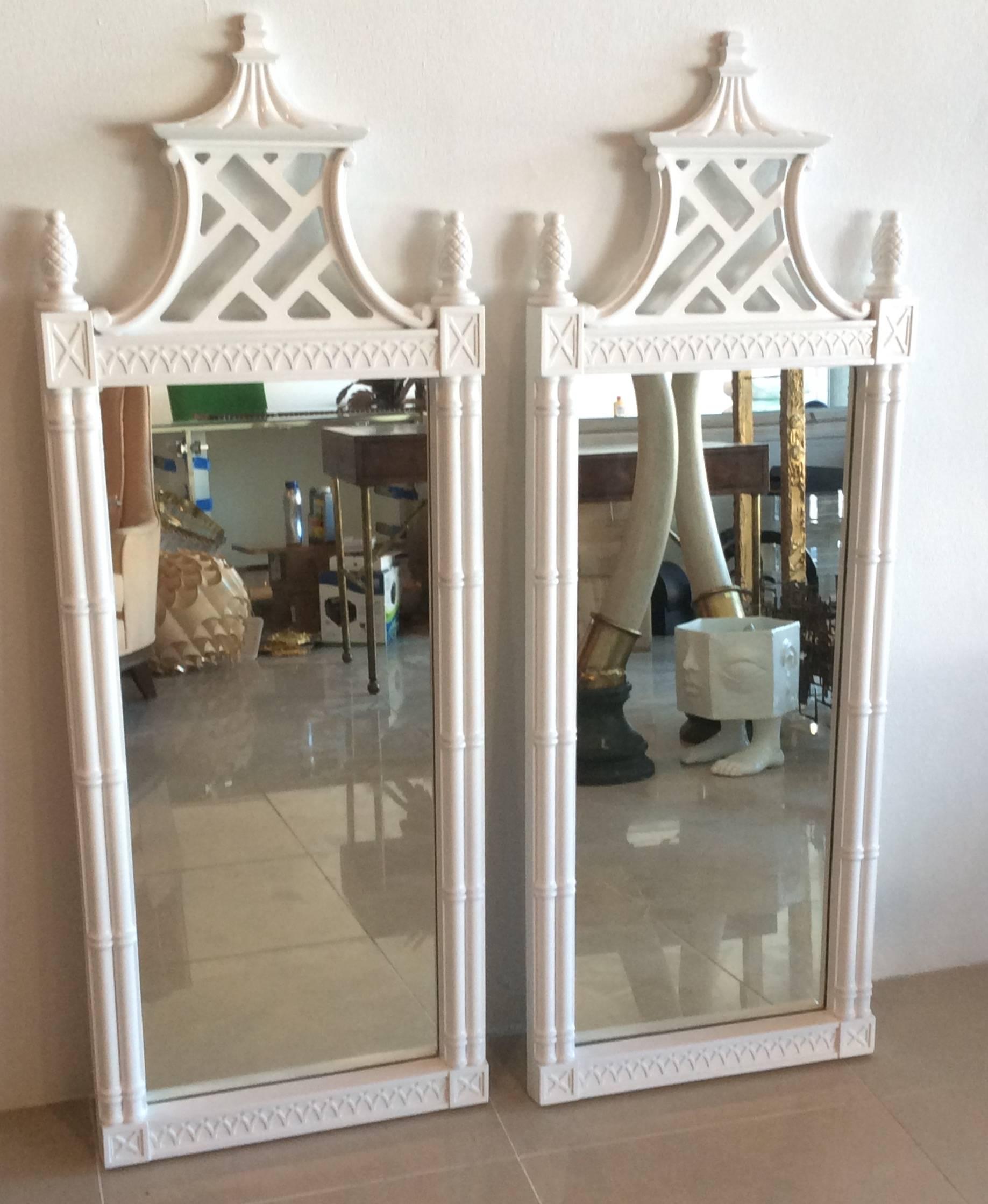 Amazing pair of Fretwork, fret work Chinese Chippendale, professionally newly lacquered white gloss pagoda wall mirrors by Thomasville Furniture. Fret work details, faux bamboo, and pineapple finials makes this piece nothing short of amazing and