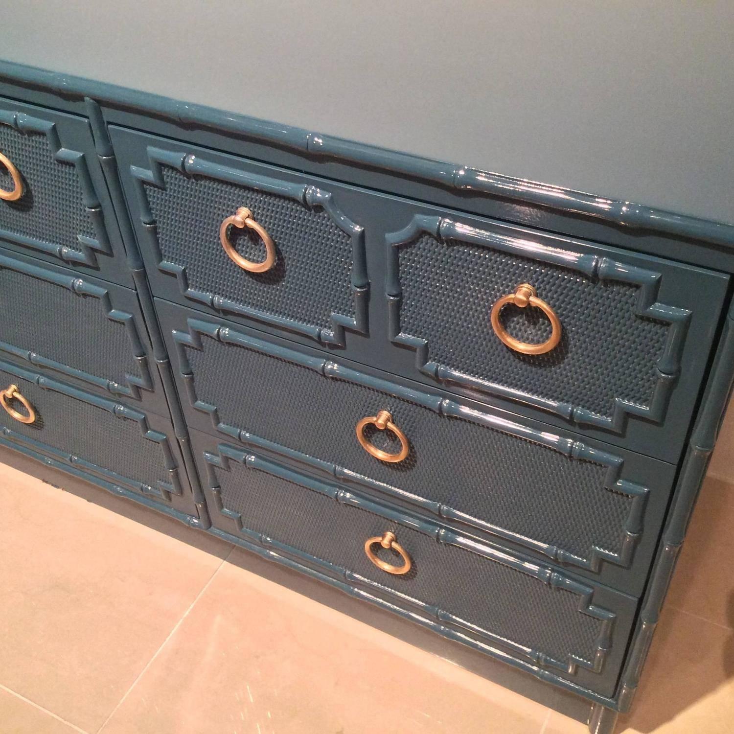 Amazing vintage Hollywood Regency, faux bamboo nine-drawer dresser newly lacquered in a teal peacock blue with lovely polished brass ring hardware. Can be used as a sideboard, buffet, or credenza also.
Matching nightstands, mirrors and other pieces