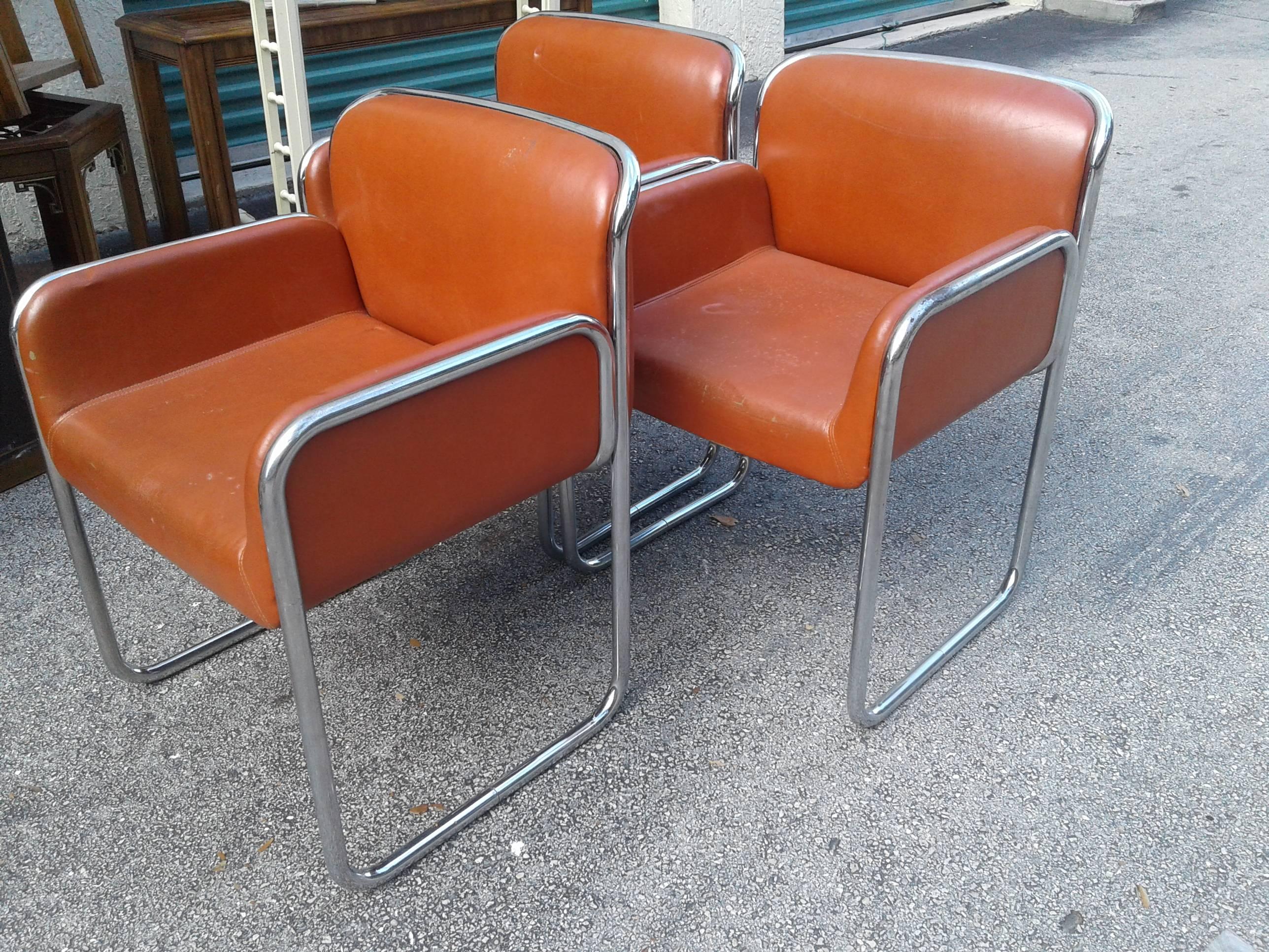 Vintage Mid Century Modern John Stuart chrome armchairs with stickers underneath, pictures. The chrome is in good condition however the original upholstery will need to be replaced. These chairs are very heavy, sturdy and comfortable. Two  available.