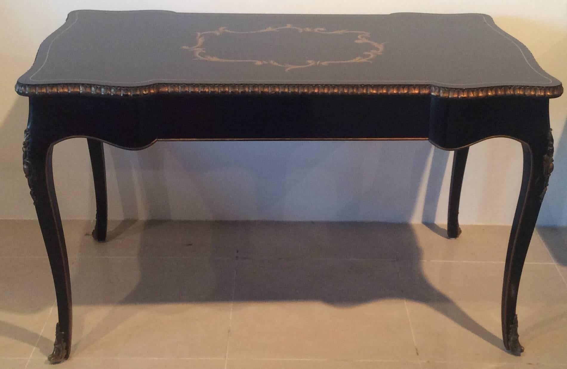 Lovely ornate vintage black and gold with ornate brass metal details on the legs French ormolu writing desk with drawer. So elegant with beautiful curves. Original finish, top has some scratches and scuffs. Brass has not been polished and has