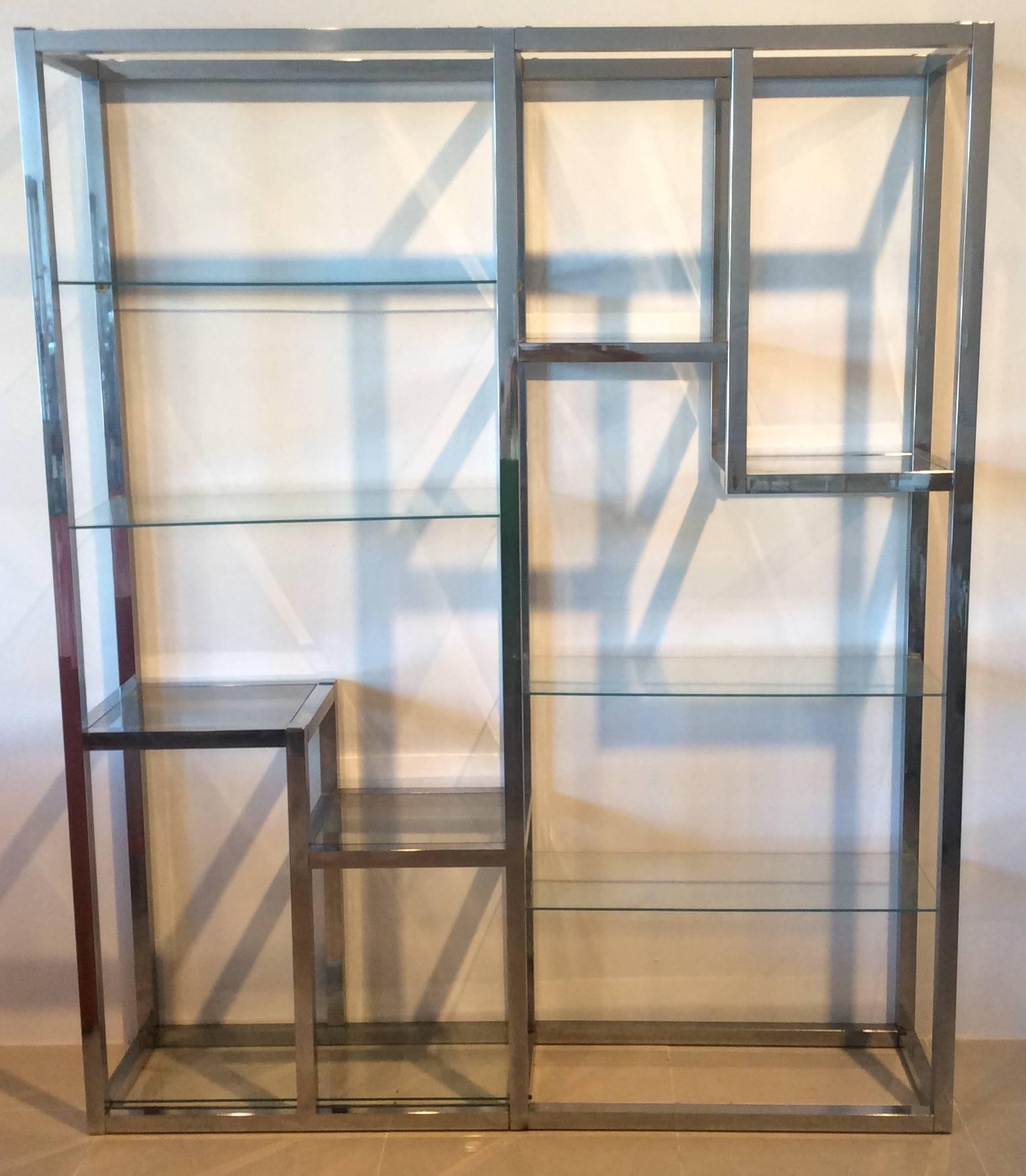 Vintage Milo Baughman Style chrome and glass display shelf étagère. There are ten glass shelves. Chrome will be polished prior to shipping. Glass shelves are included. 