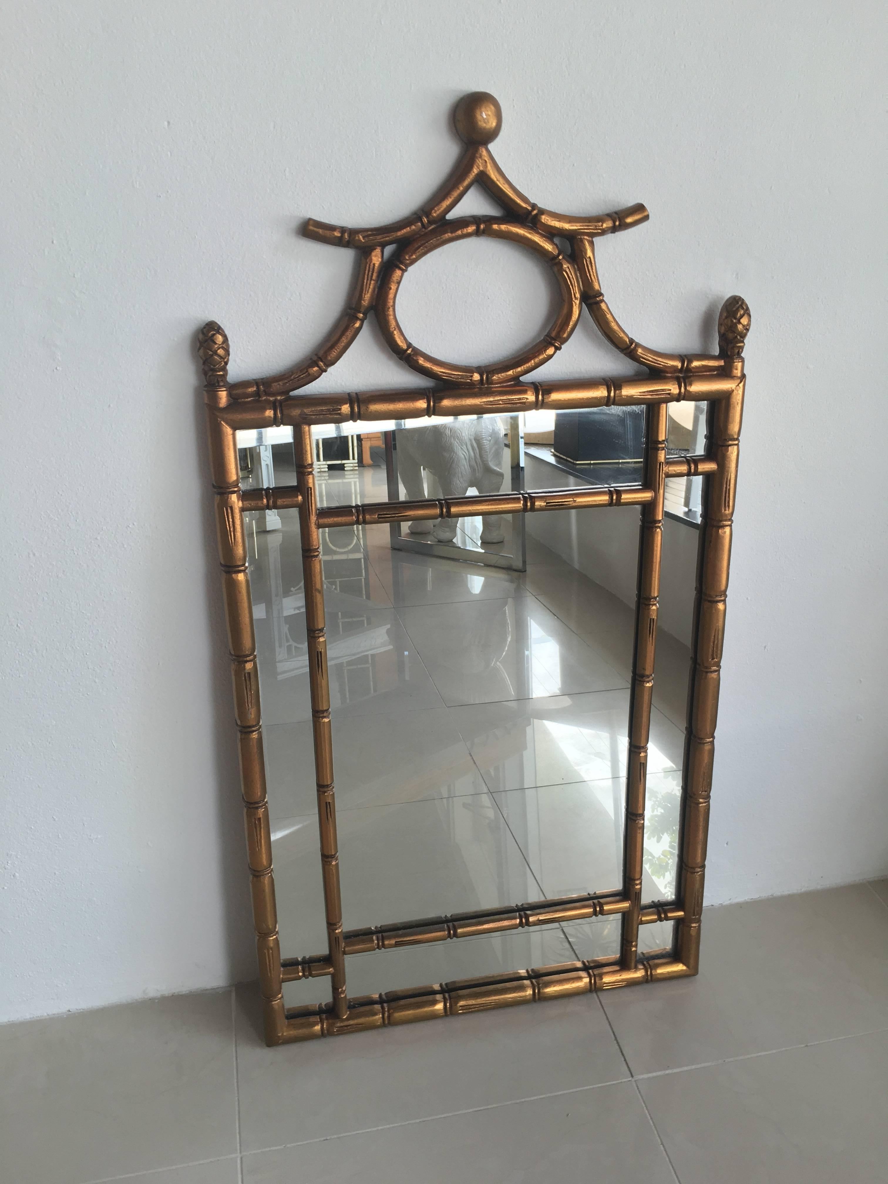 Lovely faux bamboo wall mirror with original gold finish. Comes ready to hang with wire on the back.
 