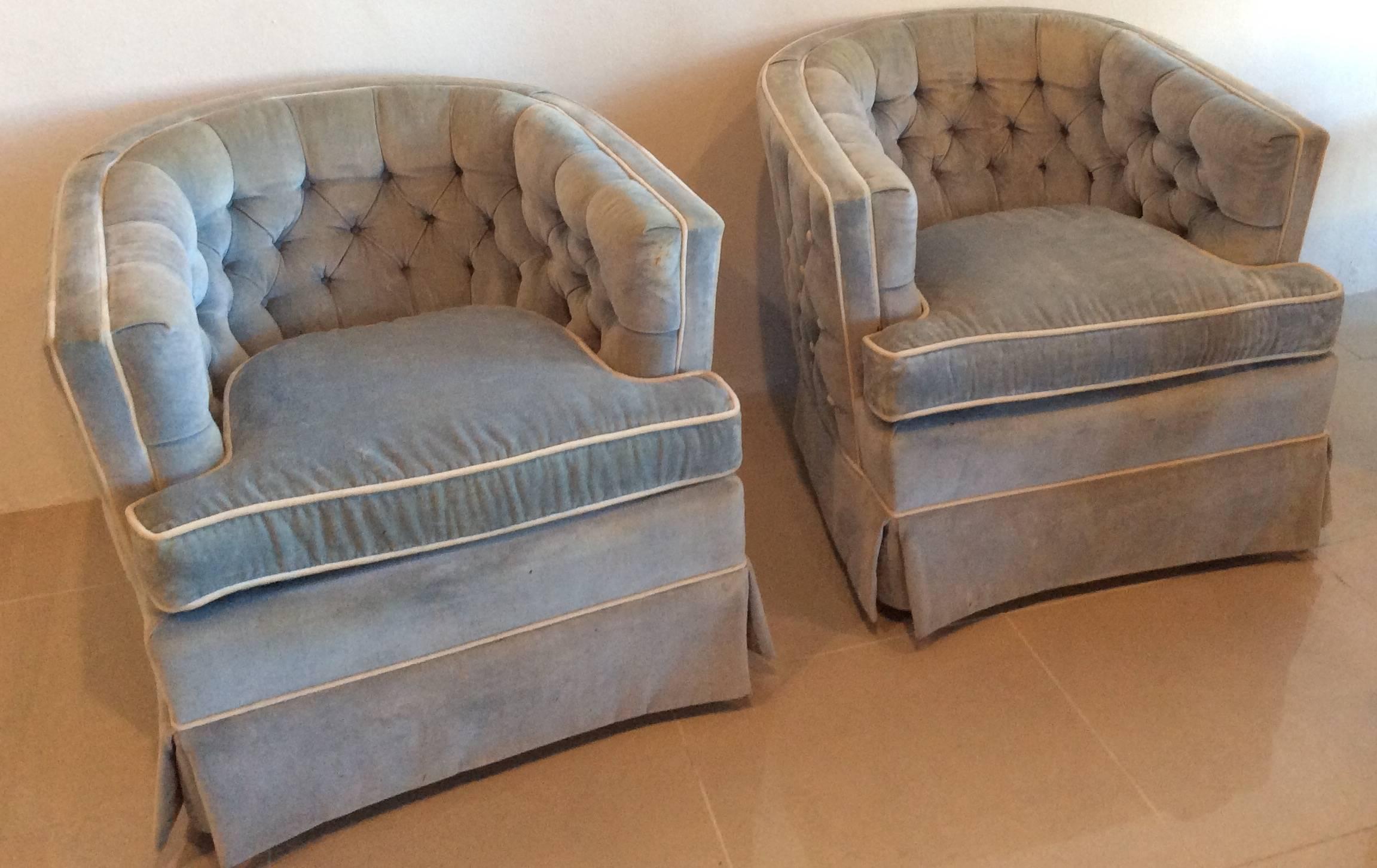 Pair of vintage swivel button tufted barrel, tub shaped club, lounge chairs. Tufted backs and front. Original vintage fabric which may have some stains and fading. New upholstery is recommended. Great Hollywood palm beach Regency flair. One missing
