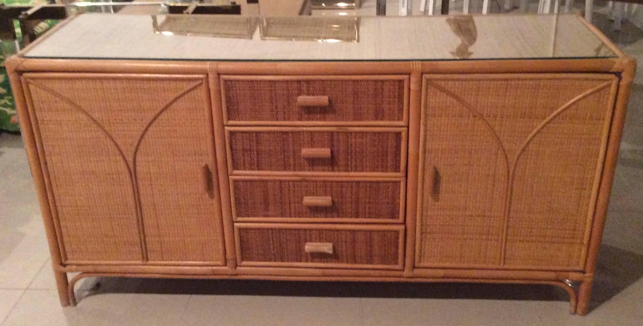 Vintage rattan woven wicker, faux bamboo, grasscloth credenza, buffet, or dresser with glass top. Top is woven wicker which is natural to have some variation in straightness which is corrected with the glass top. Great for a tropical, Palm Beach,