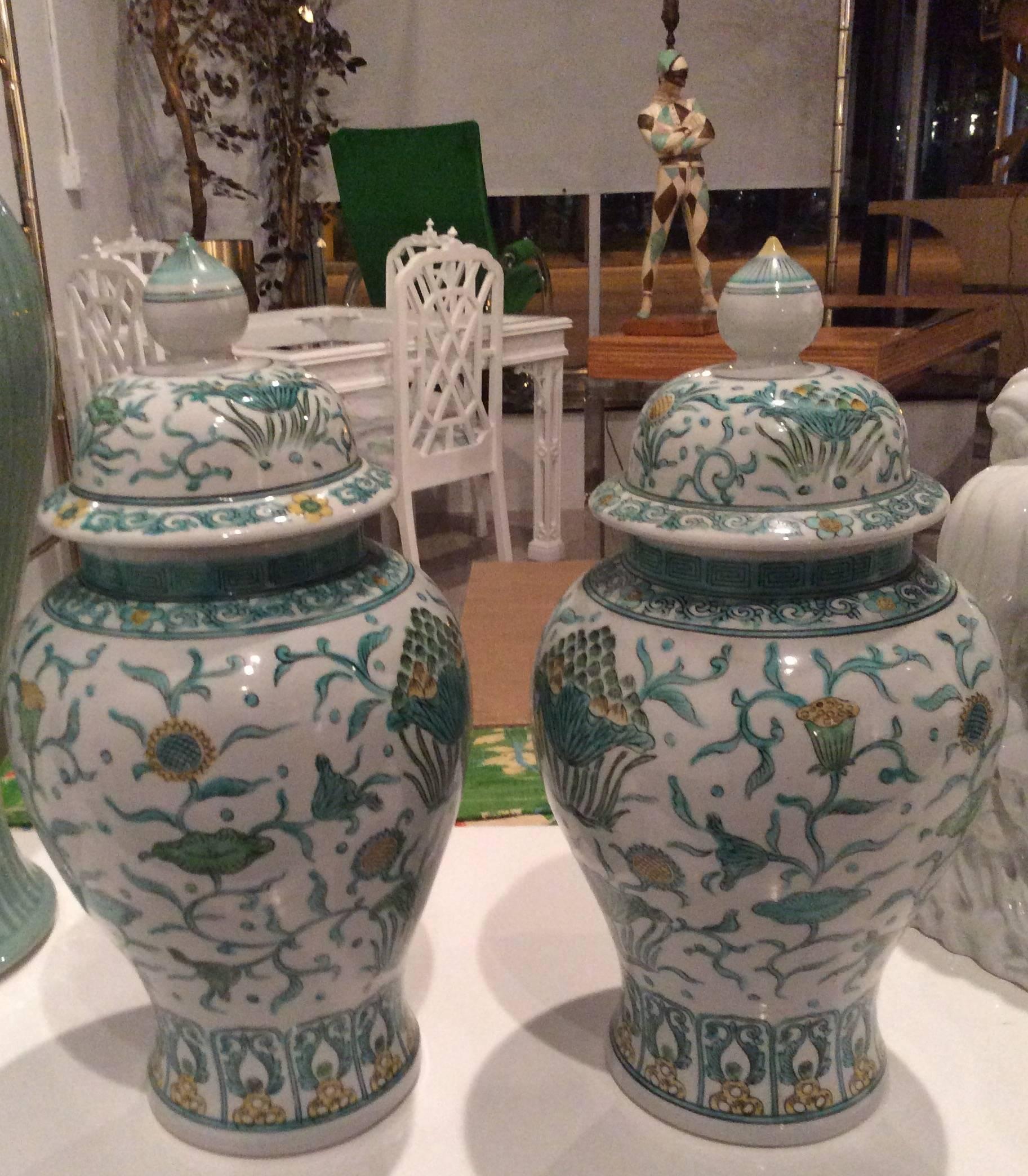 The prettiest pair of Oriental, Asian Ginger Jars with a lovely green and yellow color palette. Great Greek Key design around the neck. Made in Japan, marked and numbered underneath (pictured) No chips or breaks. 