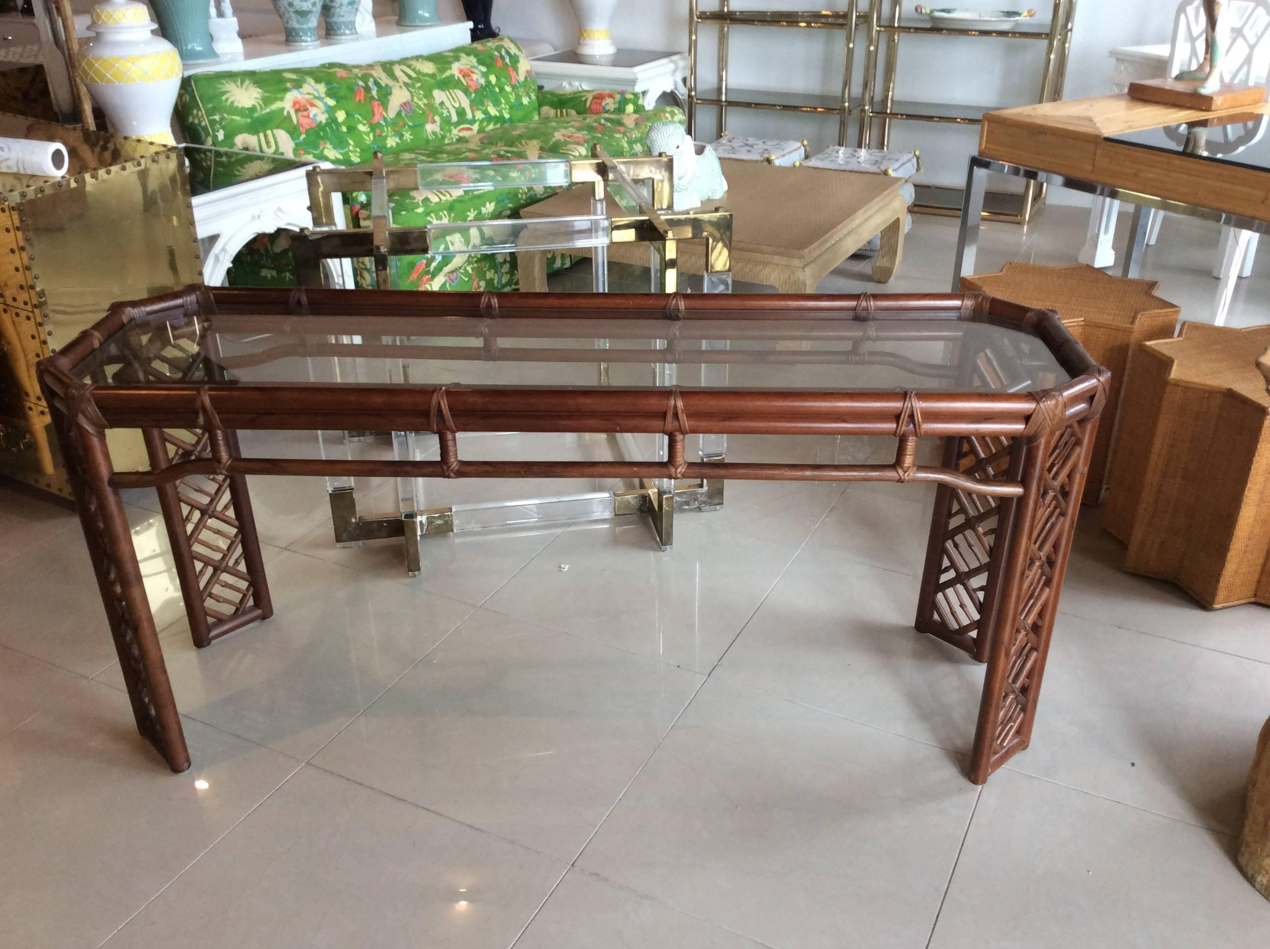 Brown Jordan (tagged, pictured) rattan console table with glass top. Perfect for the Palm Beach, tropical, Hollywood Regency home. 