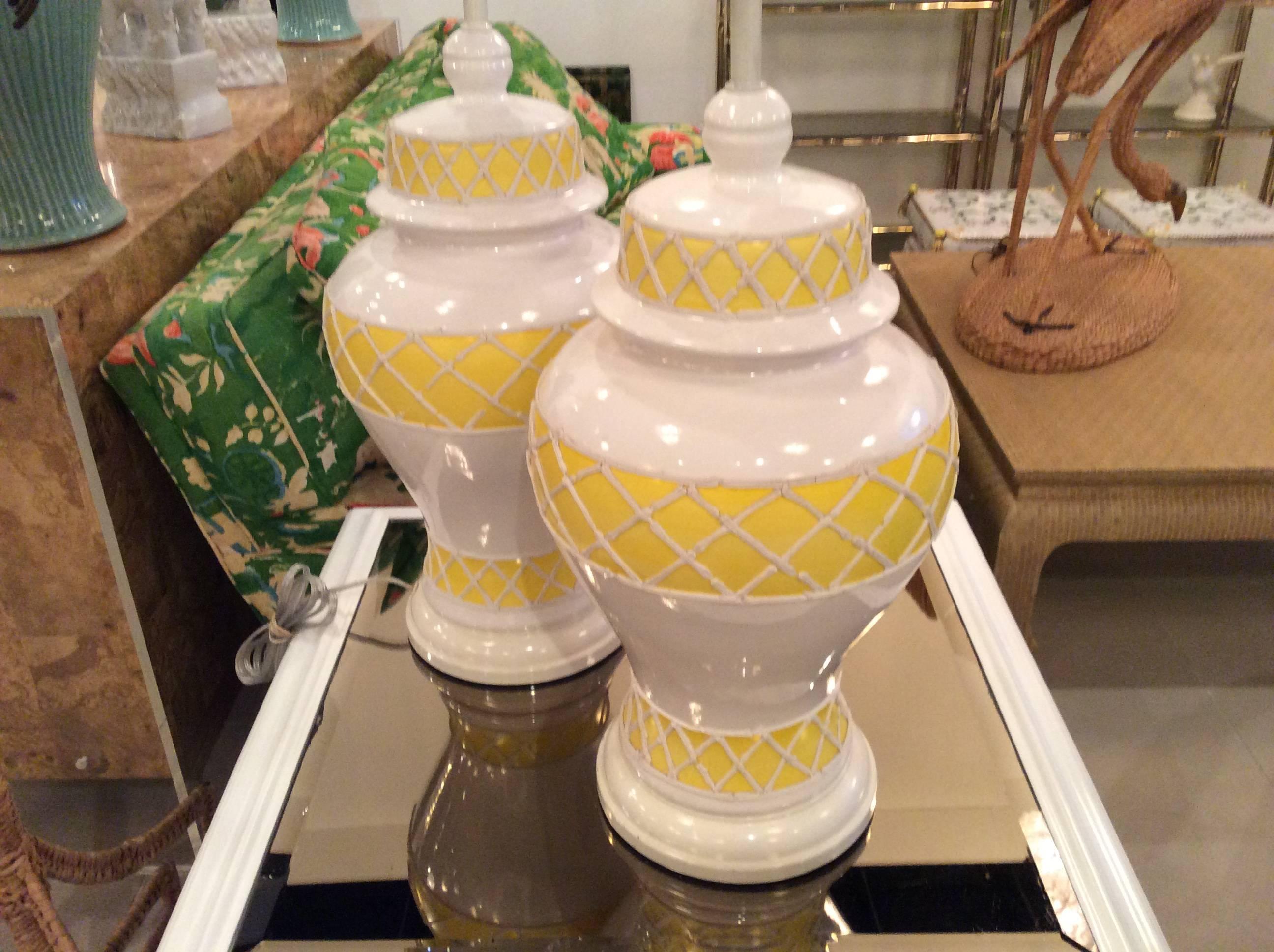 Wonderful pair of vintage yellow and white icing ceramic ginger jar lamps. Perfect for that Palm Beach decor! These will be newly rewired prior to shipping. 
24 tall to socket.
33 tall to finial