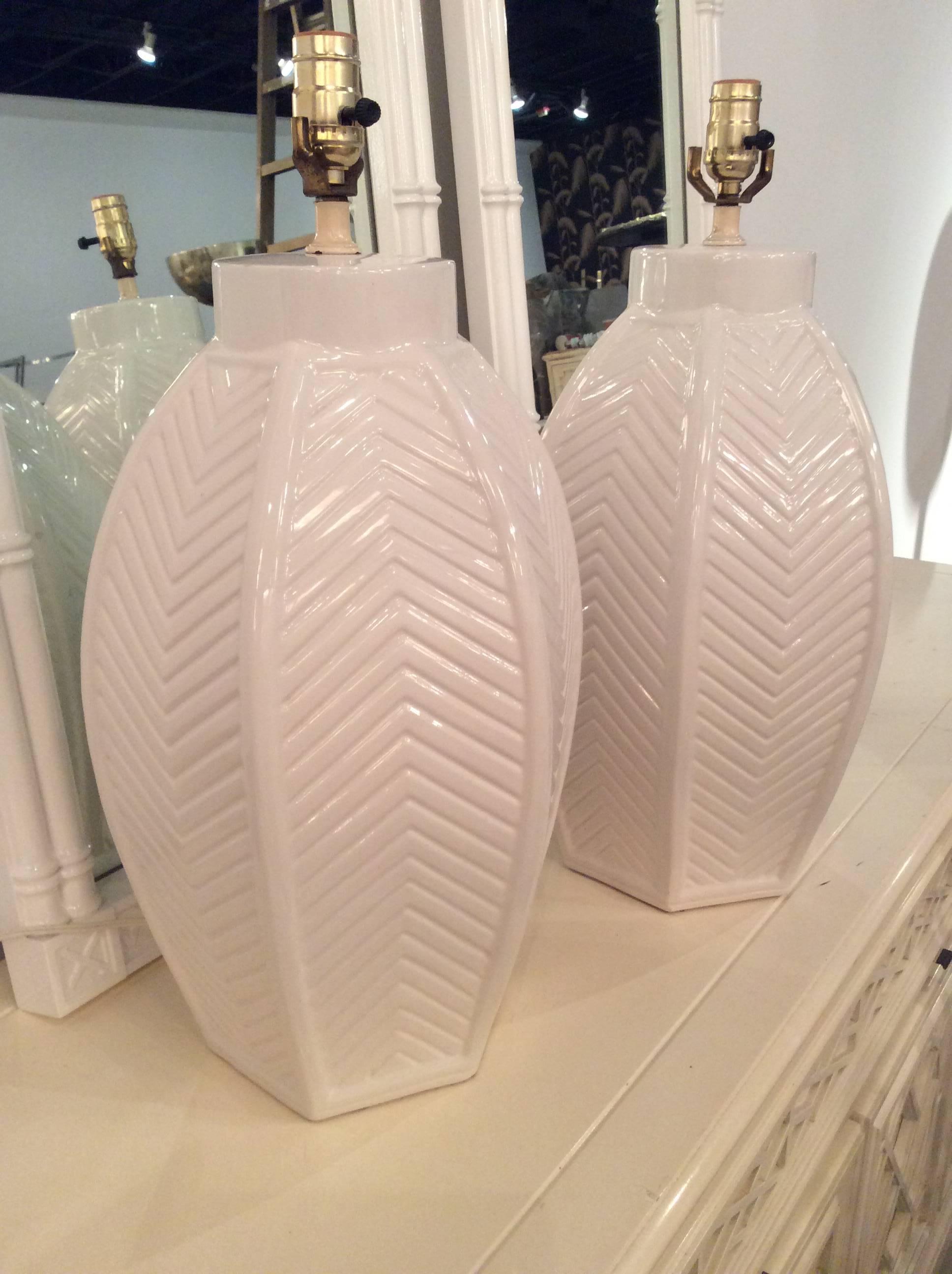 Vintage pair of large ceramic, white chevron table lamps. These will be newly rewired prior to shipping. Perfect for the Hollywood Regency, Mid-Century Modern decor.