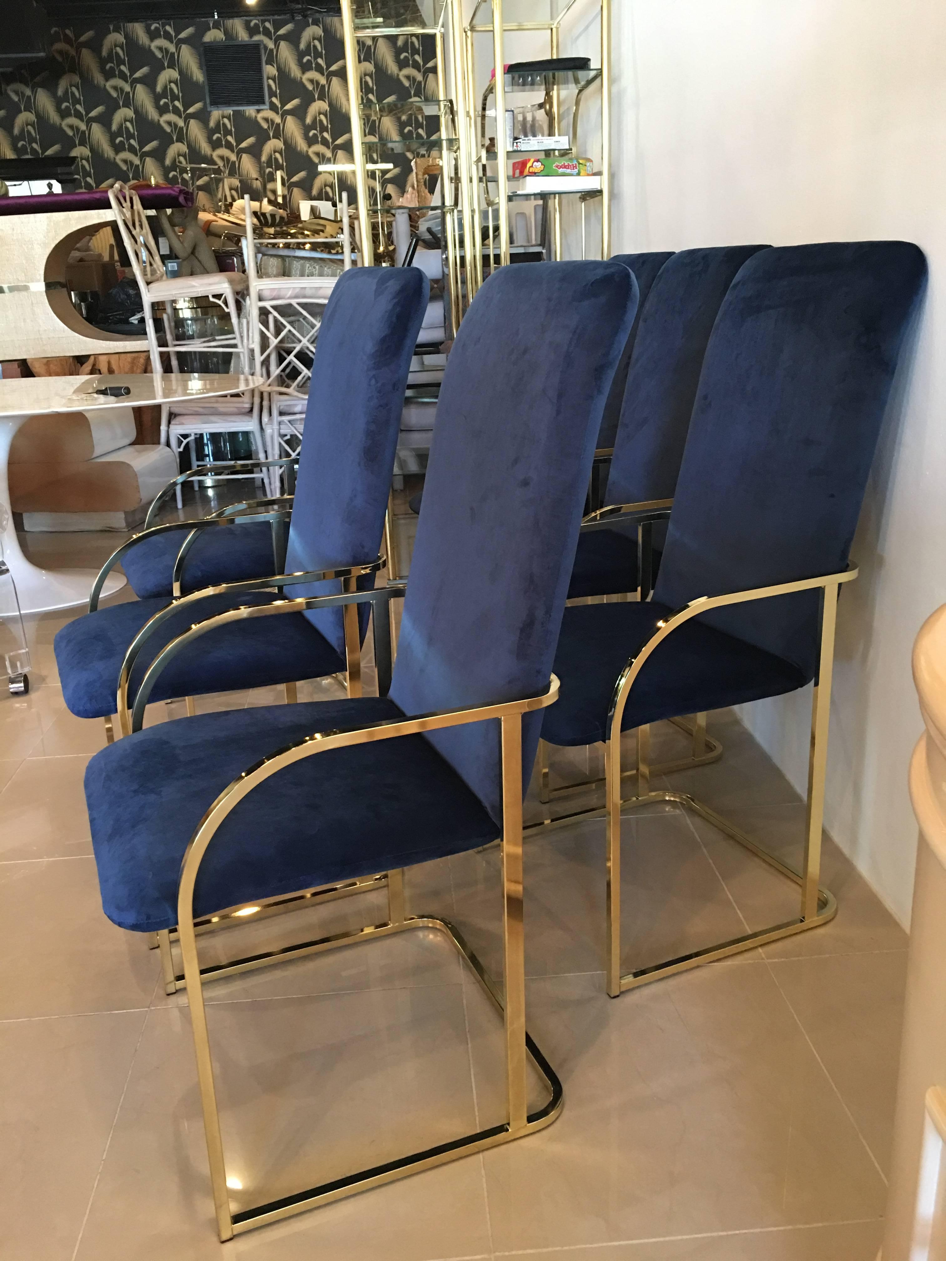 Amazing set of 12 twelve vintage dining arm chairs armchairs. Tagged DIA Design Institute of America. Newly upholstered in a blue indigo navy velvet. Brass is in overall great condition with a few patina marks here and there, above average. 
