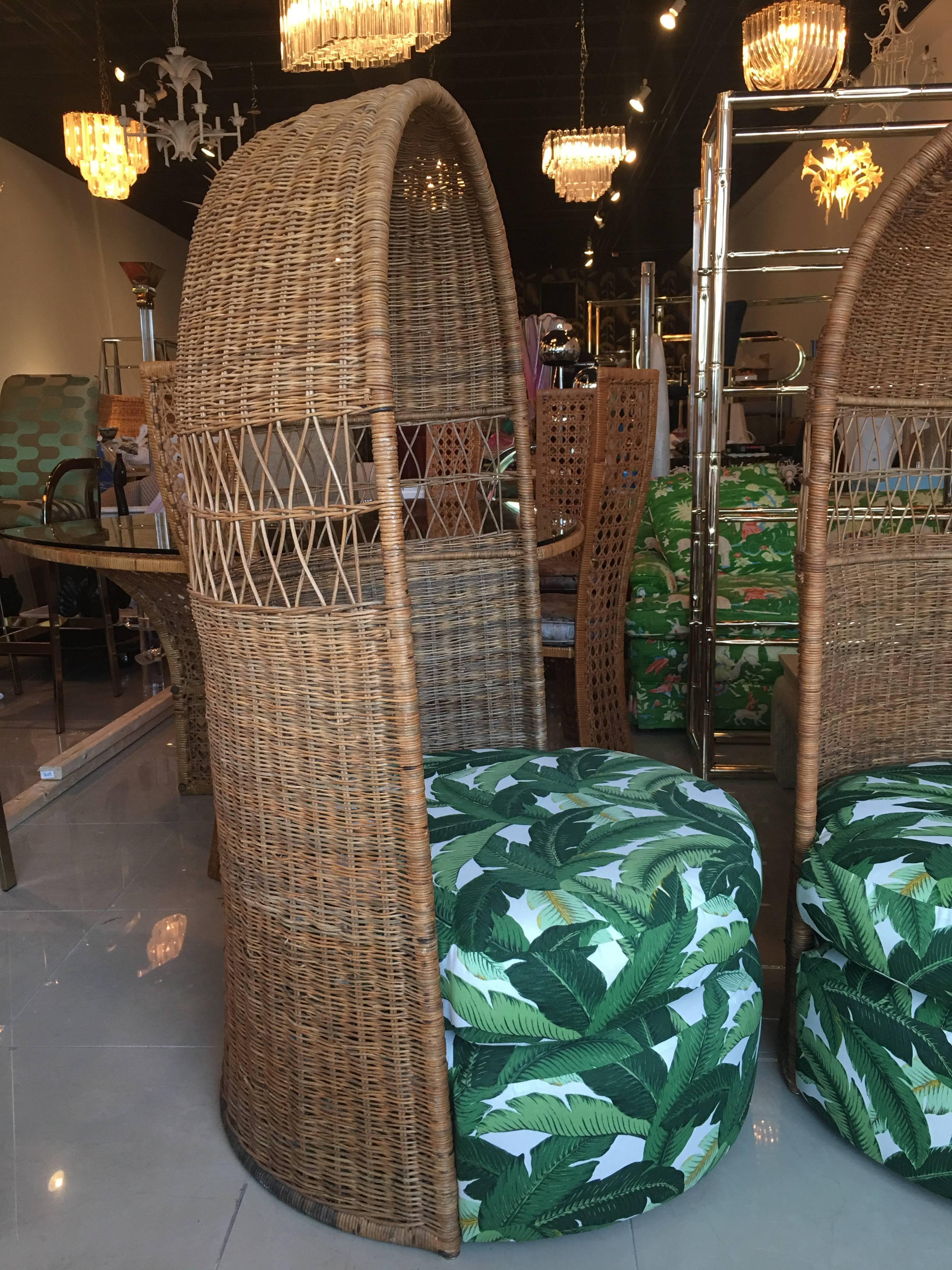 Pair of amazing vintage rattan, wicker hooded, dome chairs. Newly upholstered in a banana leaf indoor, outdoor fabric. Perfect for inside, outside, sunroom, porch or a patio. Great Tropical Palm beach island, Boho feel. Lounge chairs, club chairs 