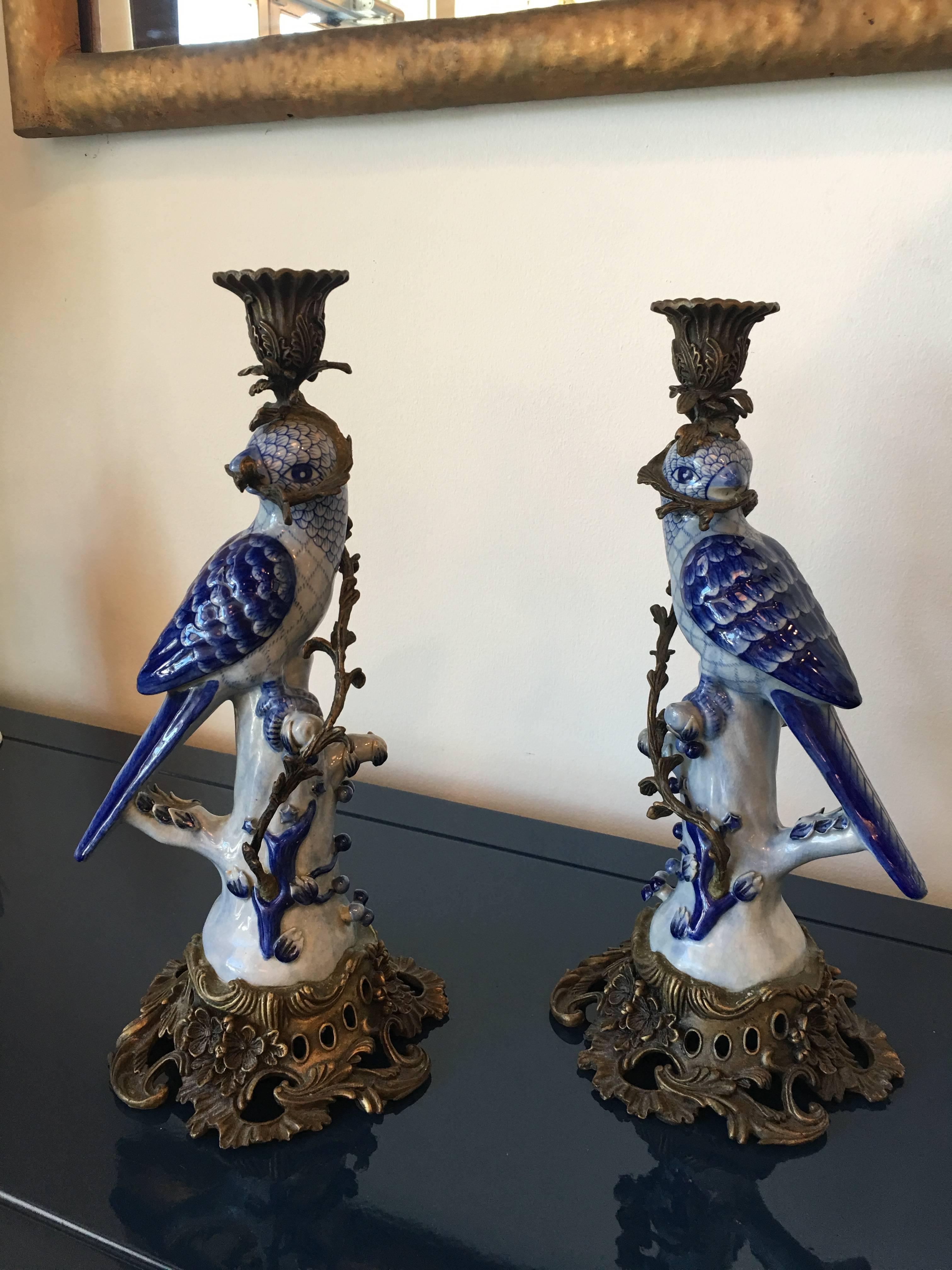 Lovely pair of large vintage ceramic blue parrot bird candleholders with ornate brass base.