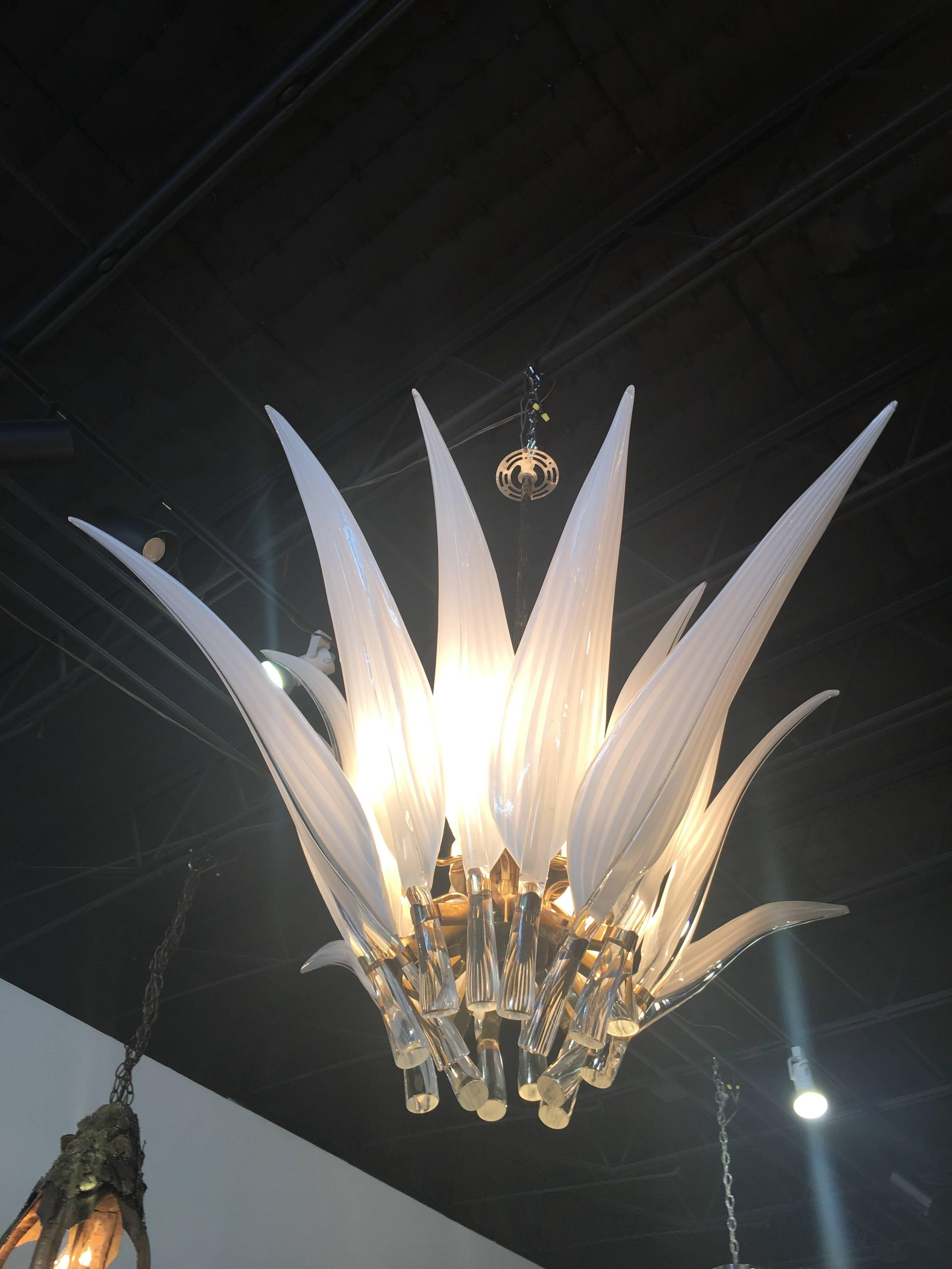 One of the most amazing vintage chandeliers I have come across! Vintage Murano Italian chandelier, made in Italy. Glass leaves and stems with brass fixture. Two of the tips of the leaves have the tip (point) chipped.
Height is to top of hook.


 