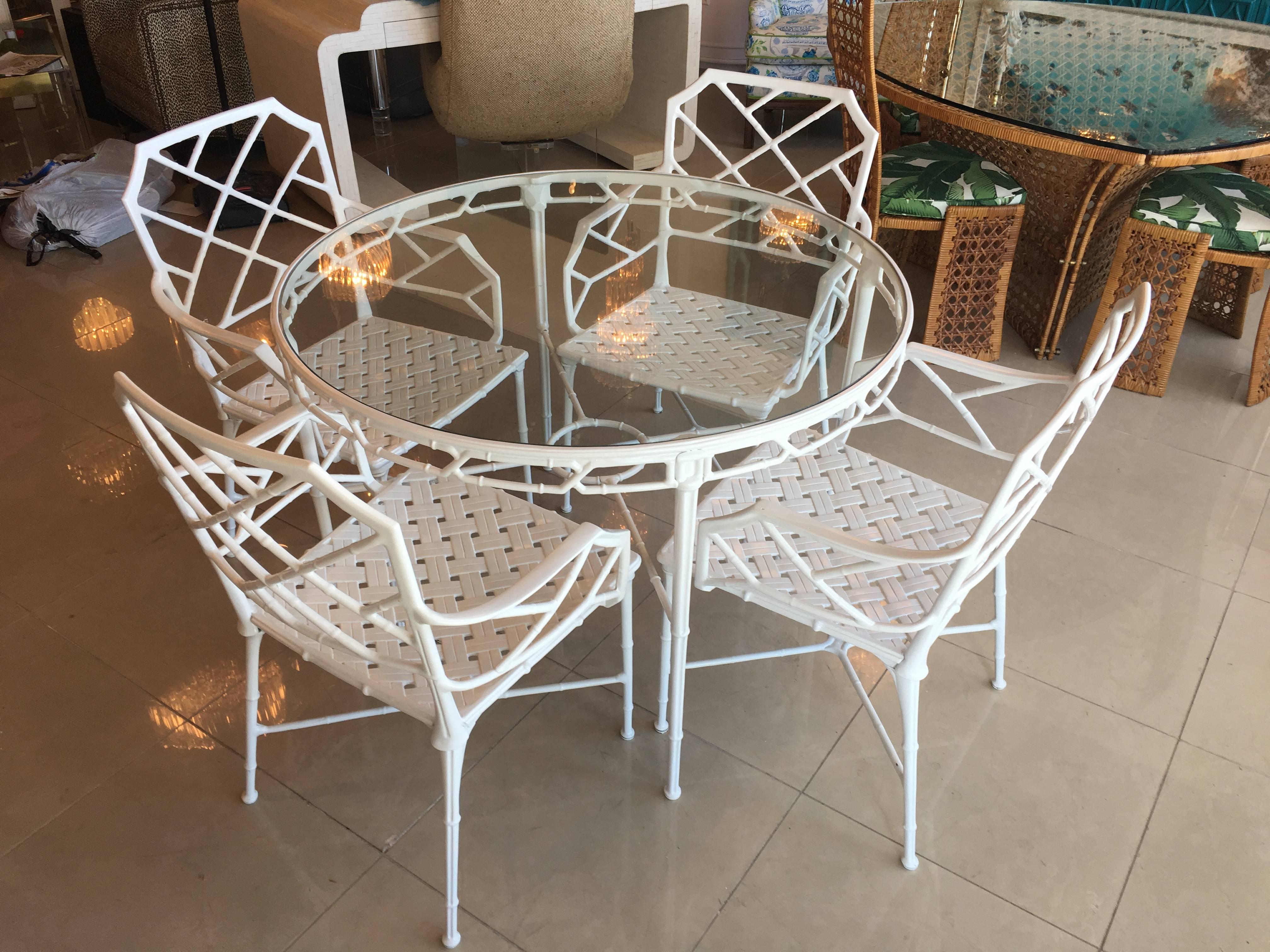 Amazing five piece 5 Brown Jordan Calcutta faux bamboo, Chinese chippendale pattern patio set. This has been newly professionally powder coated in a white gloss finish. This set includes four armchairs, arm chairs and matching patio table with round