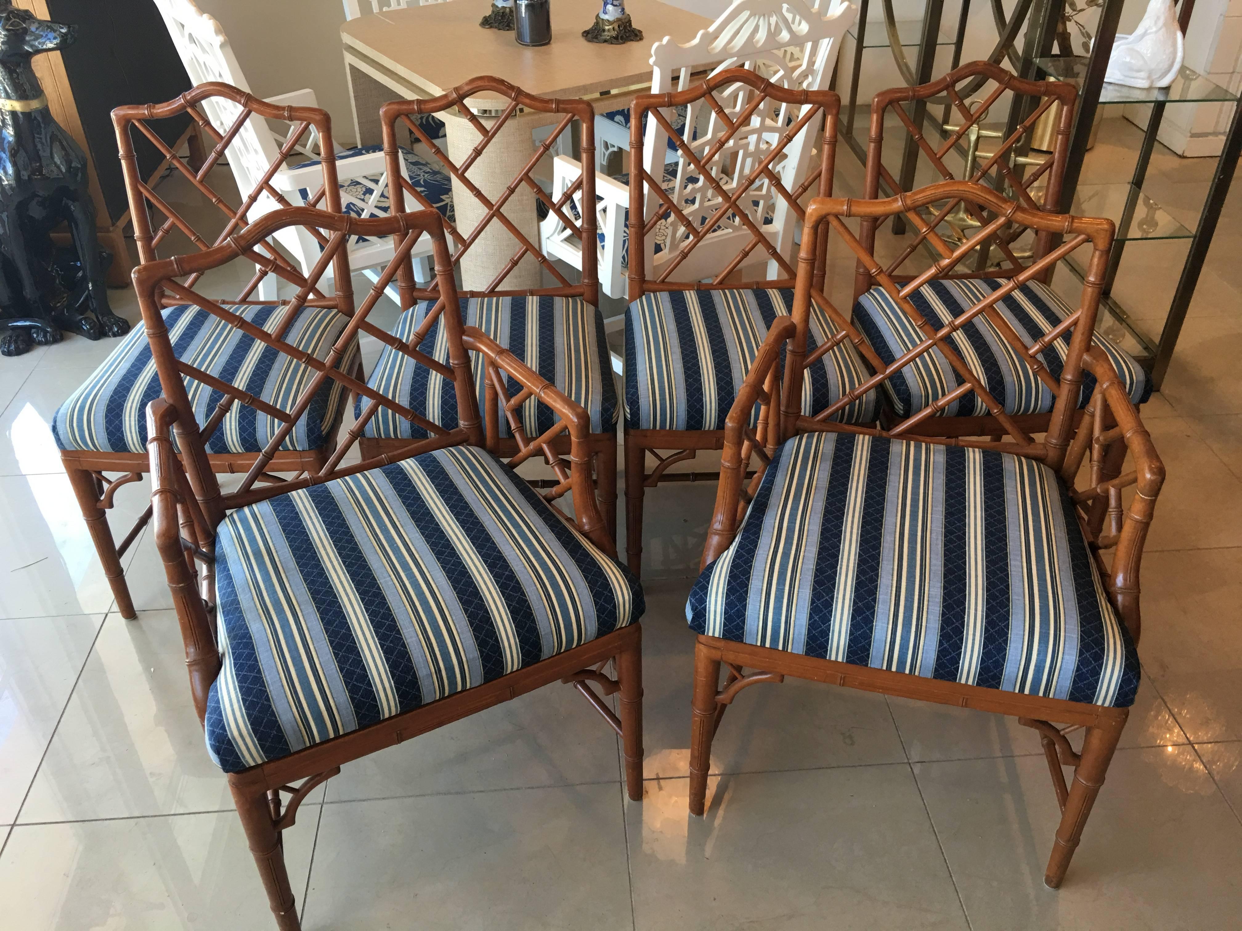 Lovely set of six Chinese Chippendale faux bamboo dining chairs. Set includes two armchairs and four side chairs. Original finish with some scuffs and scratches. Original upholstery is in great condition
Armchairs measures 36 tall x 25 wide x 19.50