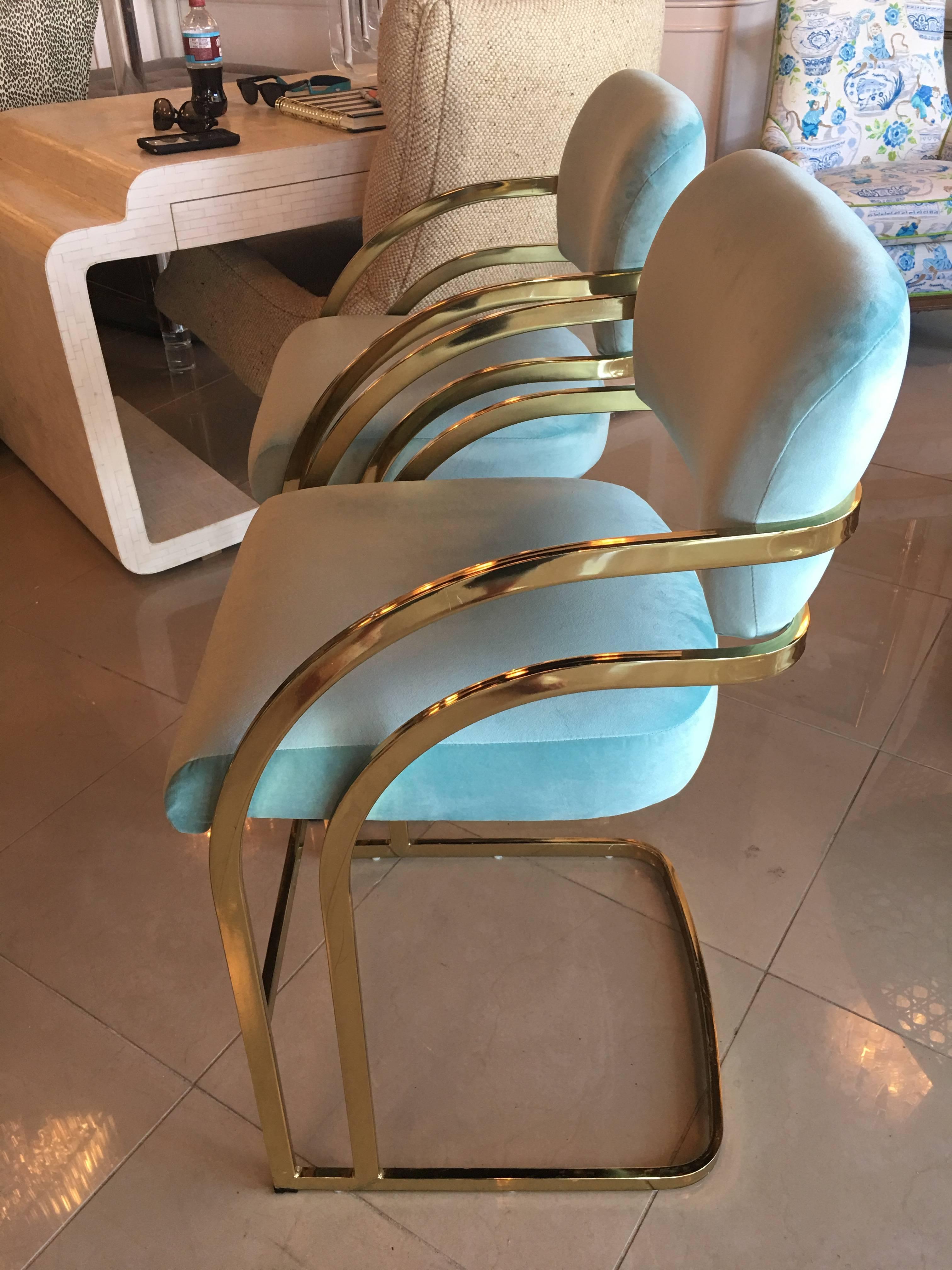 Lovely set of four 4 newly upholstered light blue velvet gold brass cantilever Milo Baughman counter height stools barstools. Very minor scuffs to some area on frame overall above average vintage condition.