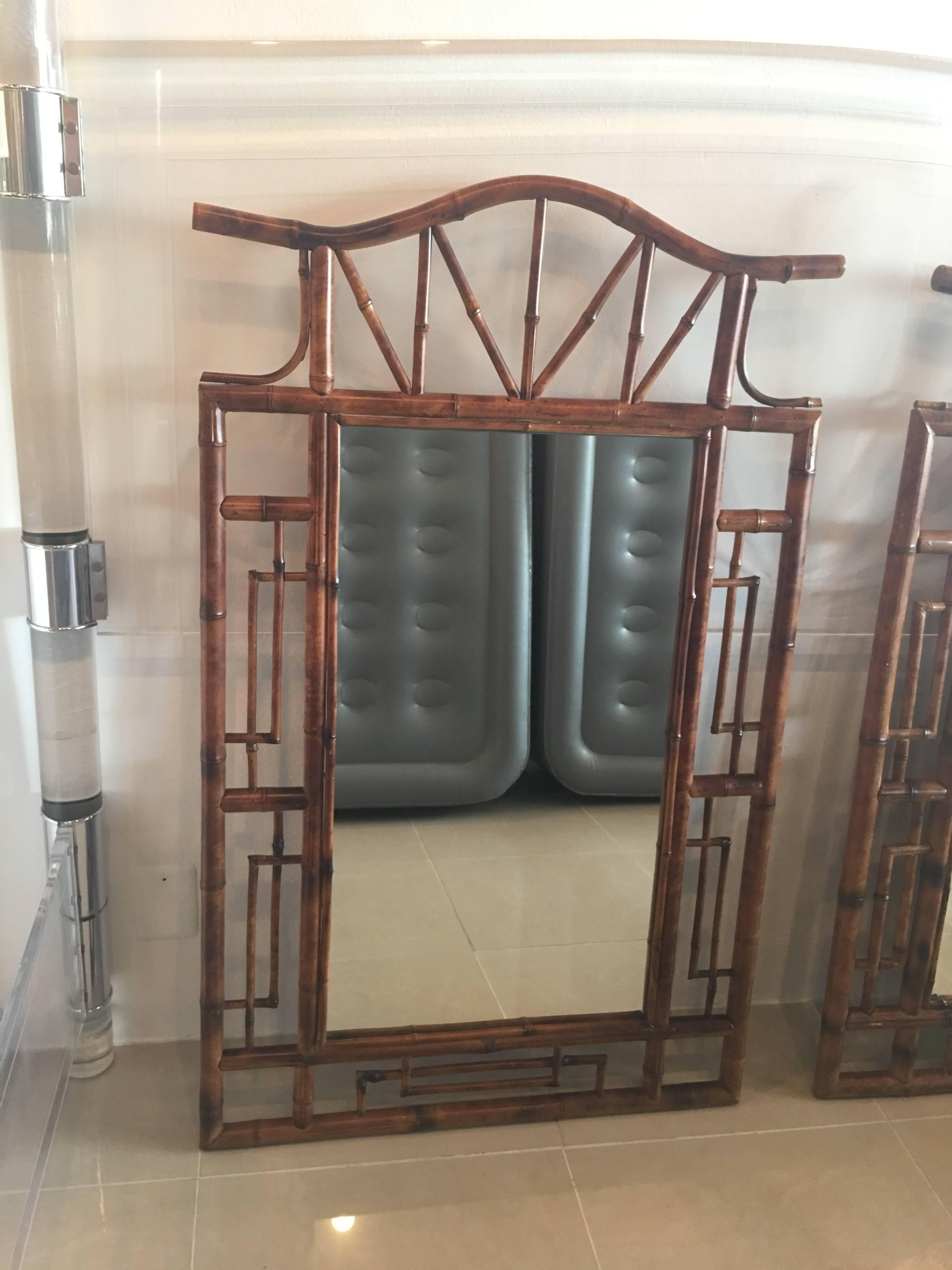 Amazing pair of vintage faux bamboo (not Rattan) wood, Chinese Chippendale, pagoda top wall mirrors. Greek key details. These are large 50.5 Tall. These have there original, natural wood finish. Price is for the pair.