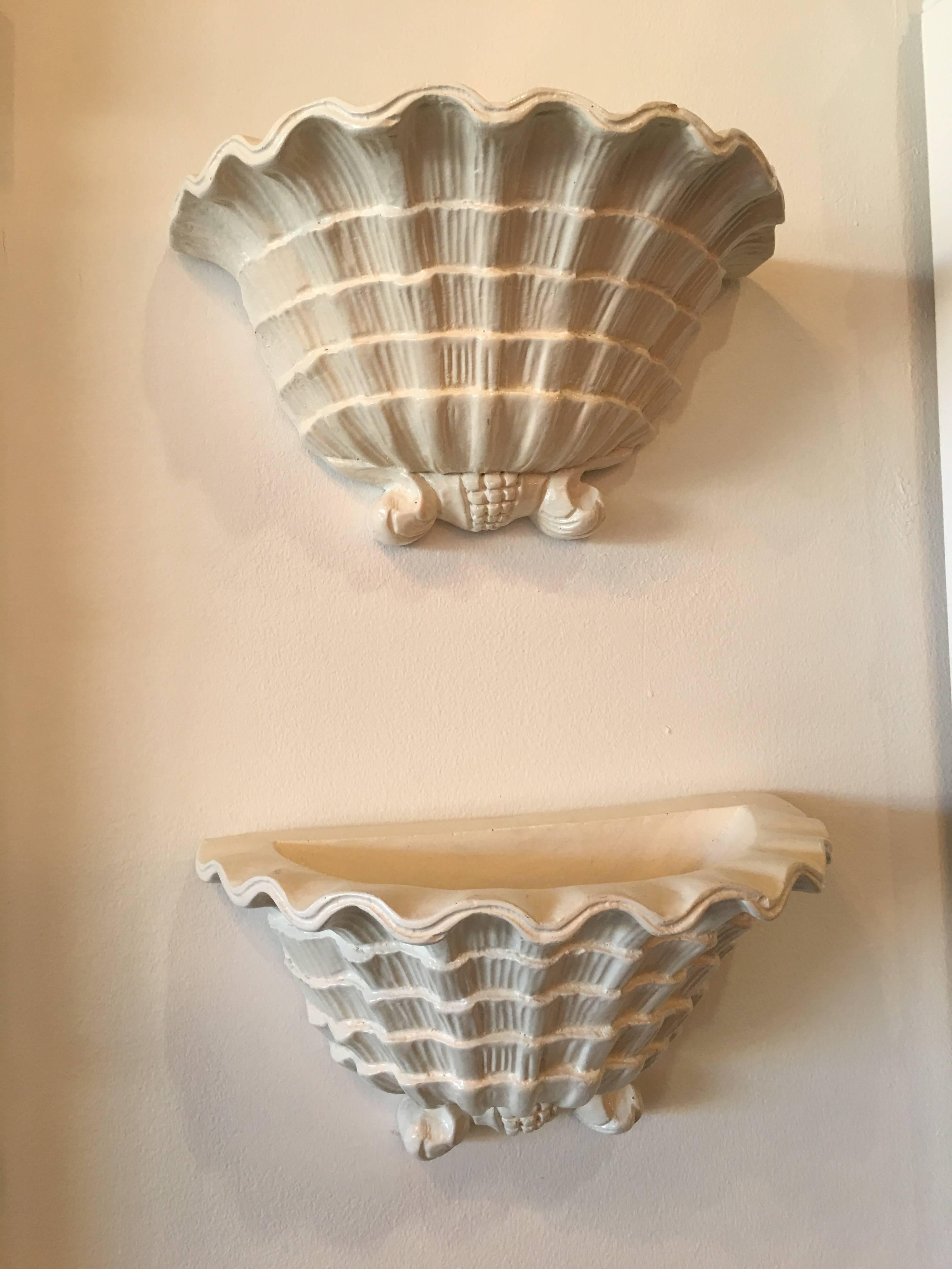 Lovely pair of vintage plaster scalloped shell seashell wall sconces in the manner of Serge Roche. Comes ready to hang. Palm Beach perfection!