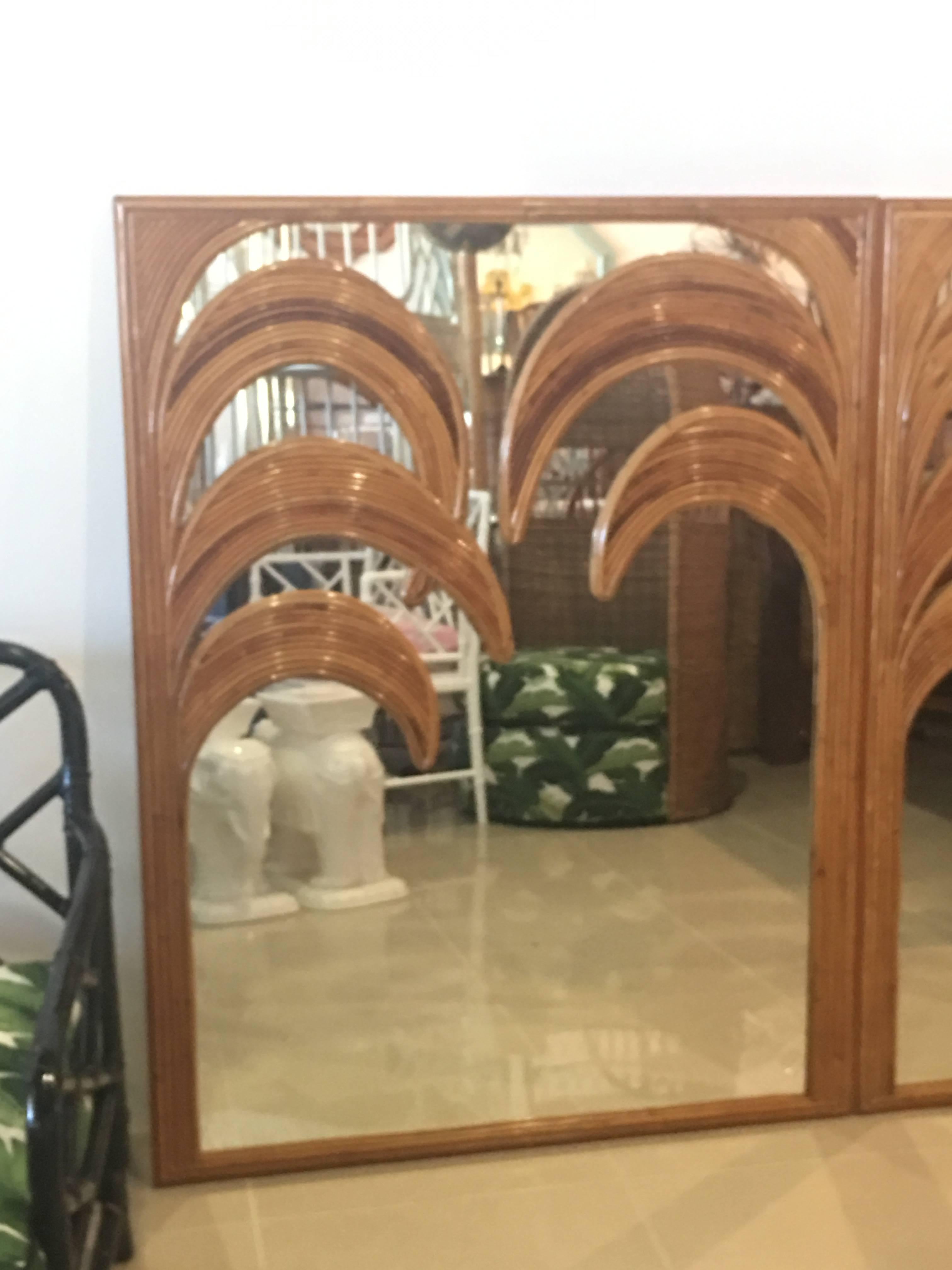 Amazing vintage one of a kind set of three oversized wall mirrors. Made from split reed bamboo. These work as a set of three to form the palm tree, fronds, leaves. These can also be used individually. Sold as a set of three. Great Palm Beach Island