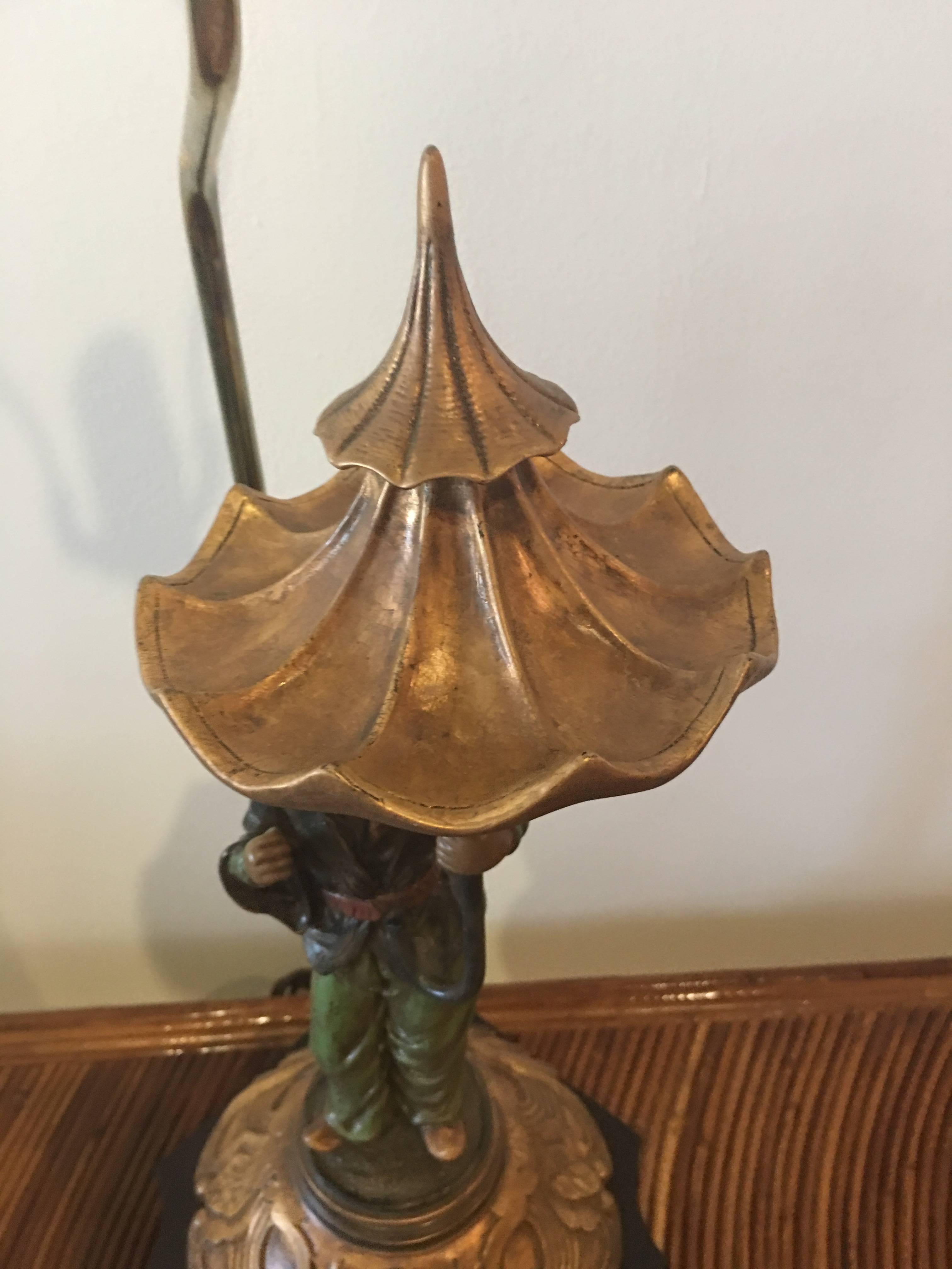 Lovely vintage chinoiserie oriental lamp holding a pagoda umbrella. Brass socket and finial, no lampshade. 
23.5 to socket
32.5 to finial.